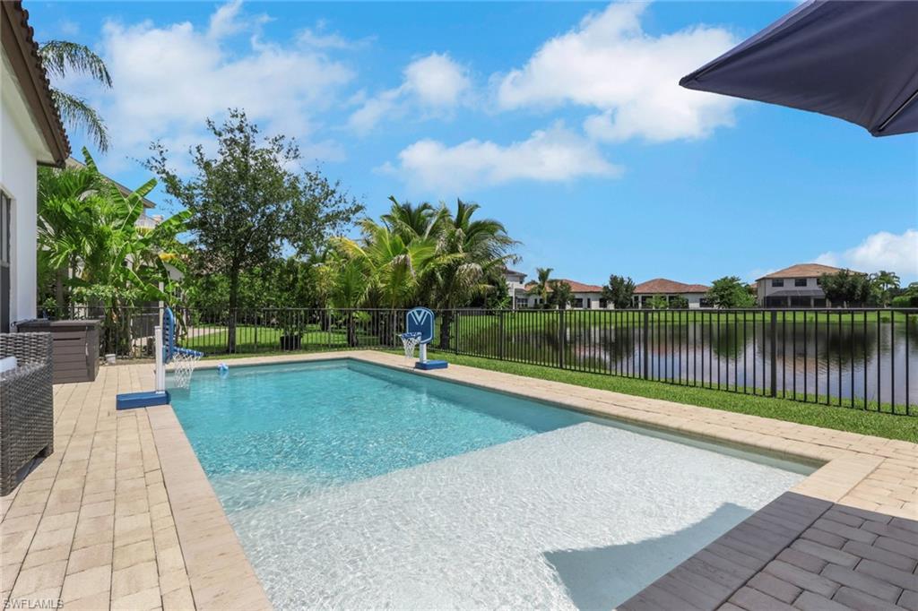 PRICE ADJUSTMENT! BEAUTIFUL LAKEFRONT POOL HOME WITH SOLAR SAVINGS AND EXCEPTIONAL VALUE IN AVE MARIA! Welcome to 5386 Ferrari Ave! Priced well below a recent $600,000 appraisal! Don't miss this incredible opportunity to own a beautiful lakefront home in the desirable community of Ave Maria, Florida. This spacious home features 3 bedrooms plus a generously sized den with the potential to be converted into a 4th bedroom, offering flexible space for guests, a home office, or additional living needs. Step outside and enjoy the Florida lifestyle with your own private pool overlooking peaceful lake views. Whether you're relaxing poolside, entertaining family and friends, or simply enjoying the beautiful waterfront setting, this backyard offers the perfect place to unwind. Adding even more value, the home features solar panels that have helped keep monthly electric bills under $99, offering potential energy savings. With its beautiful lakefront location, private pool, versatile floor plan, and price well below a recent $600,000 appraisal, this home presents an exceptional opportunity in Ave Maria. Enjoy comfort, relaxation, and incredible value all in one! Schedule your private showing today and discover everything this home has to offer!