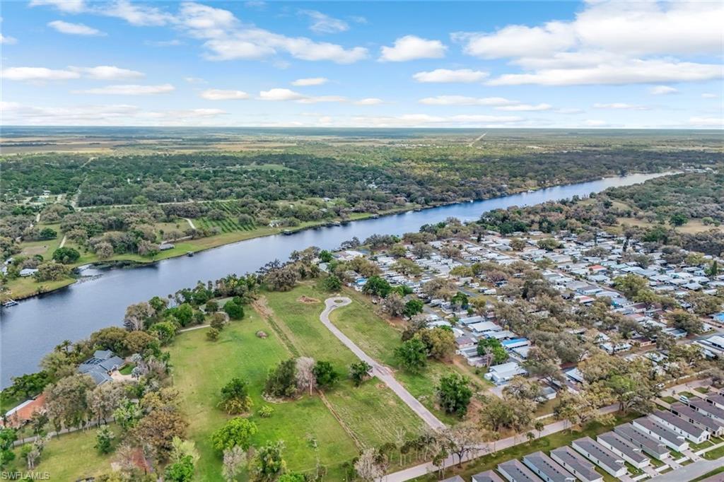 Welcome to your riverfront oasis! Nestled along the picturesque shores of the Caloosahatchee River, this vacant land offers a rare opportunity for microcottage/tiny home community. Picture-perfect oak trees line the street, offering a canopy of shade and natural beauty. With approved zoning for mircocottage/tiny homes, envision a community where simplicity meets serenity, where each dwelling is a testament to sustainable living and close-knit community. Whether it's waking up to the gentle rustle of leaves or enjoying sunset strolls along the riverbank, this is your canvas to create a lifestyle of tranquility and connection with nature. Don't miss out on the chance to turn this idyllic setting into your own slice of paradise!