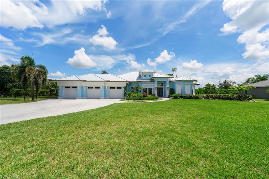 A statement of refined luxury, timeless elegance, and exceptional living. Set on an impressive 1 acre estate lot, this extraordinary 5-bedroom, 4.5-bath residence offers a rare combination of grandeur, sophistication, and resort-style living. Beyond the striking double-door entry, you are welcomed into an expansive, light-filled interior where scale, openness, and elegance come together effortlessly. Designed for both luxurious everyday living and sophisticated entertaining, the residence features generous living spaces with an inviting open-concept flow and an abundance of natural light. The kitchen is a true centerpiece, offering an impressive amount of cabinetry and storage, sleek stainless-steel appliances, and an expansive layout perfectly suited for entertaining. Adding an unmistakable touch of sophistication, the dramatic floor-to-ceiling wine display creates a stunning architectural focal point and elevates the entertaining experience. The luxurious living experience continues outdoors, where a spacious covered patio opens seamlessly to a private resort-style setting. A sparkling pool and spa are surrounded by an expansive open pool deck, creating an exceptional backdrop for elegant entertaining, relaxing afternoons, and unforgettable evenings beneath the Florida sky. The generous 1 acre homesite provides the space and privacy to truly enjoy your own private sanctuary. Thoughtfully enhanced with substantial recent upgrades, the home features a new metal roof installed in 2024 and two new A/C systems installed in 2024, offering modern efficiency and peace of mind. A spacious 3-car garage completes this remarkable property, providing ample room for vehicles, storage, and lifestyle needs. Grand in scale. Sophisticated in design. Exceptional in every detail. This is more than a residence—it is a private luxury retreat crafted for those who appreciate space, elegance, comfort, and the finest elements of Florida living.