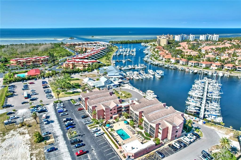 PRICE REDUCTION!! WATERFRONT with a MARINA VIEW!! FULLY FURNISHED & TURNKEY!! (please see list of excluded items) Cute 1 bedroom/1 bath condo, Keel Club has the best price and the best location in the Marina community! Appliances and kitchen lighting replaced in 2020, AC replaced in 2021, Lanai has screening and new vinyl sliders plus a roll-down aluminum storm screen. Washer/dryer unit replaced 2024. Large LR window replaced with a new hurricane-rated window.  Perfect for investors due to a strong short-term rental history, or for seasonal owners as well. Convenient first floor condo has a wonderful view of the boats coming and going, and is within a short walk to the dockmaster office, the Tennis and Fitness Center, the Tradin' Post deli and store, and the large marina restaurant which has entertainment every night. Roomy screened lanai for morning coffee and sunset cocktails! Large heated pool and sun deck. Burnt Store Marina is a true resort community with 27 golf holes, a friendly Country Club restaurant, many walking paths, and boating of all kinds. This is the largest deep-water Marina on Florida's west coast with easy water access to the Gulf of Mexico and the barrier islands of Sanibel, Captiva, Boca Grande, and the ICW. Welcome to your little Piece of Paradise!!