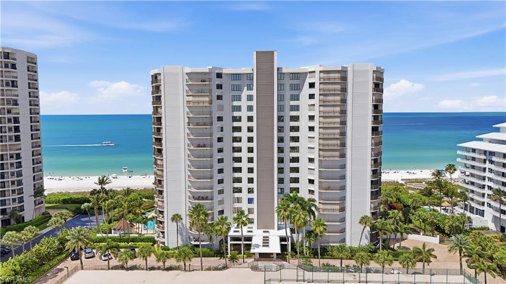 Paradise is in full view at this exceptional residence in the prestigious Marbelle Club on Marco Island. Perfectly positioned along one of Southwest Florida’s most beautiful stretches of beachfront, this fully renovated and professionally furnished condominium offers an unparalleled coastal lifestyle. From the moment you enter, you are greeted by a seamless blend of contemporary sophistication and relaxed elegance. The open-concept design is ideal for both entertaining and everyday living, all while showcasing sweeping Gulf views and spectacular sunset backdrops. Every detail of this residence has been thoughtfully curated. The gourmet kitchen features crisp white custom cabinetry, stainless steel appliances, quartz countertops, and a striking full quartz backsplash. The dining area is enhanced by a newly added wet bar with wine refrigeration, while the living space is anchored by a custom built-in with a recessed electric fireplace—creating a warm yet refined focal point. Both bathrooms have been beautifully reimagined with upgraded cabinetry, designer tile flooring, and spa-inspired walk-in showers, completing the home’s luxurious coastal aesthetic. For added peace of mind, the residence is equipped with impact-resistant sliders and manual shutters, offering both convenience and protection. Experience beachfront living at its finest—this is a rare opportunity not to be missed. Schedule your private showing today.