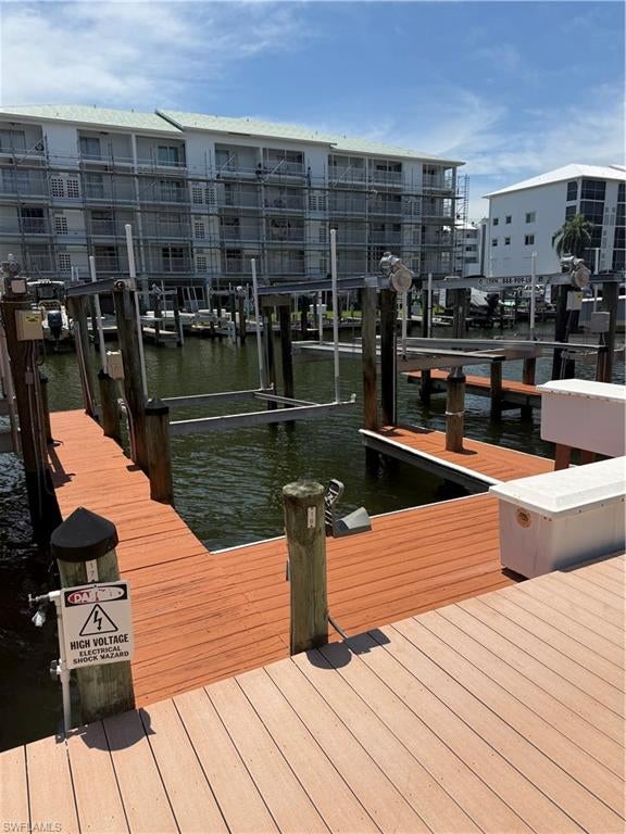 BOAT DOCK # 18 at desirable Hibiscus Pointe condos. NEW motor, cables and GEM remote controller all updated after 2022. Enjoy no bridges and direct Gulf access, making it quick and easy to reach open waters for fishing, boating or stop at your favorite waterfront restaurant. Annual Hibiscus Pointe Boating Coop fee: $400 per quarter (including taxes, water and electric). Sales application fee: $150. Must be an owner in Bay Beach Community to purchase. Non-Hibiscus Pointe condo owners may have to pay additional parking fee.