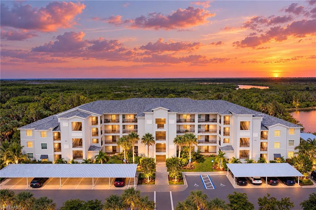 This very private third floor TURNKEY Birkdale unit offers a social membership to the incredible resort style community of Heritage Landing Golf and Country Club. Once inside this home, you will be greeted by a fabulous open air floor plan boasting 9' high ceilings. Diamond set tile runs throughout the living area, with great natural light from the kitchen window and sliding doors, which frame inspirational sunsets. Impact glass windows are featured throughout. Open the sliding door to let in the tropical breeze or step out to watch the abundant wildlife outdoors. The roomy kitchen offers bright shaker style cabinets topped with handsome quartz countertops, with stainless appliances...a great place to create a culinary masterpiece. Retreat to the light and bright master bedroom suite which has a large walk-in closet and an additional linen closet. Continue on to the roomy ensuite bathroom with a large, tiled roman shower. The guest bedroom has its own adjacent bathroom with tub and shower combination. Store all of your beach going needs in the exterior storage closet. Special features include: Covered carport, Ring Video Doorbell Pro, Honeywell Home Smart thermostat, and Smart front door lock. Amenities at Heritage include a beautiful resort style pool with beach entry featuring separate lap lanes and a Tiki Bar nearby, 4 additional satellite pools, a lovely Clubhouse for upscale dining, fitness center, full-service spa, sauna, 6 Har Tru tennis courts, 6 pickle ball courts, and 2 bocce courts. This home is located conveniently within minutes to the local Punta Gorda airport!