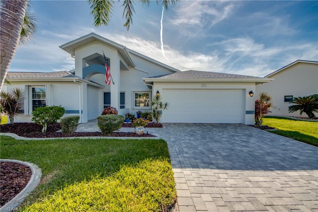 NOW IS THE PERFECT TIME TO PURCHASE YOUR OWN PIECE OF PARADISE!  PRICED RIGHT TO SELL!  This Meticulously Maintained + Spacious Turnkey Home is on the Golf Course with a Beautiful Lake View.  Located in the heart of a Very Active, 55+ Community only steps from the Restaurant, Pool + Club with its many resort style amenities.  Home offers  2 Bedrooms, 2 Baths, Huge Great Room, Family Room, Kitchen with WALK-IN PANTRY, Large Laundry Room with plenty of storage + 2 CAR GARAGE.  KITCHEN boasts  REFACED RAISED PANEL CABINETRY + CORIAN COUNTER-TOPS, LG FRENCH DOOR REFRIGERATOR, AND BOSCH DISHWASHER W/ STAINLESS STEEL INTERIOR.  MASTER BATH HAS BEEN REMODELED WITH NEW CABINETRY, NEW SHOWER + ENCLOSURE, AND NEWER COMMODE. There is also a GARDEN TUB WITH SPA JETS.  ORIGINAL EXTERIOR WINDOWS HAVE BEEN REPLACED WITH HURRICANE WINDOWS IN 2011.  THERE ARE ALSO ACCORDION SHUTTERS AND Newer ELECTRIC SHUTTERS ON LANAI FOR EFFORTLESS HURRICANE PROTECTION AND SECURITY.  The LARGE TILED LANAI HAS BEEN NICELY EXTENDED to enjoy our Florida weather and dining al fresco. PAVER DRIVEWAY and Double Door Entry grace the exterior.  Roof 2012, AC system 2019, Water Heater 2017.  LOW MAINTENANCE FEE of $380 per month paid quarterly covers Cable, Wi-Fi, Lawn Care, Painting of the Exterior, and Membership in the Club.  Golf + Restaurant use are optional.