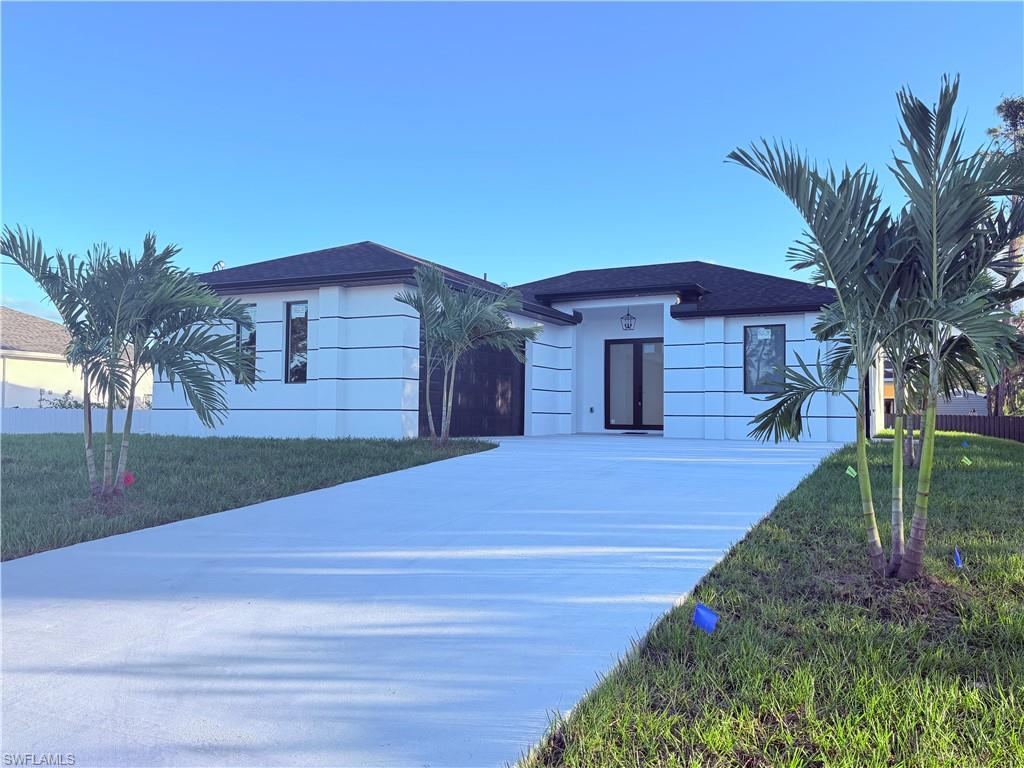 Discover modern living in this beautifully designed new-construction home featuring 3 bedrooms and 2 bathrooms. The home offers a stylish, contemporary design with an elegant tray ceiling that adds a touch of sophistication. The kitchen features crisp white cabinetry and sleek quartz countertops, creating a bright and inviting space perfect for everyday living and entertaining. Enjoy the convenience of a private patio, a side-entry garage, an in-home washer and dryer, and an automatic sprinkler system for easy lawn maintenance. With its modern finishes and functional layout, this home offers comfort, style, and convenience. Don't miss the opportunity to make this beautiful new home yours!