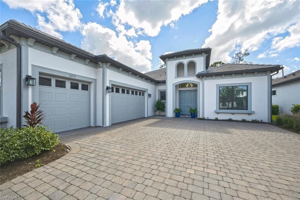 Soaring ceilings, refined finishes and tranquil wooded views define this elegant Pulte Aventura residence. Offering 4 bedrooms, 3.5 baths and 2,672 sq. ft., the home features 12-foot ceilings, tray details and 8-foot solid interior doors. The gourmet kitchen pairs quartz countertops and an expansive island with 42-inch cabinetry, glass-front uppers, a 48-inch GE refrigerator and KitchenAid gas cooktop, wall oven and microwave. A beverage station with wine cooler elevates entertaining. The owner’s suite is a serene retreat with bay windows, a tray ceiling and a freestanding soaking tub. Sliding glass doors reveal a screened outdoor oasis with a 32-foot custom gas-heated pool, covered lanai and lush wooded backdrop. Pre-plumbing accommodates a future outdoor kitchen. Impact windows and doors throughout, a gas tankless water heater, HVAC UV purification and Whirlpool washer and gas dryer add everyday comfort. A three-car garage with epoxy floors and a 220-volt outlet completes this sophisticated Naples retreat.