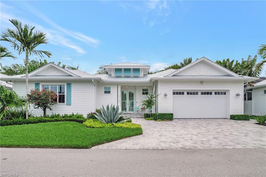 Stunning, contemporary, open concept home with three full en-suite bedrooms. As well as being completely furnished, the owner is willing to convey title to the 2023 Jeep Wrangler and golf cart stored in the garage. Ready for your immediate occupancy and enjoyment this season.  The great room has 15 foot celings, skylights, and a kitchen containing almost any upgrade one could dream of for gourmet dining and entertaining - including a large Subzero wine cooler, and a Fisher Paykel 5 burner cooktop gas range, Kinetico reverse osmosis water system and water softener.  Operate your blinds with ease, with the Hunter Douglas motorized blinds througout the home.   Use the one touch remote or an app that you simply download to your mobile device.  Open a wall of glass sliders to enjoy your outside living room.  Equipped with a screened-in lanai, TV, heated pool with auto filler, LED lighting, modern Lynx grill and outside refrigerator.  Landscape lighting surrounds the home, enlarged 500 gallon buried propane tank, 22KW backup generator, monitored alarm system with hard-wired outside cameras, ring door bell, and garage camera. Two separate air conditioning units are under semi-annual maintenance contracts.  One for the entire home and a mini split for the third, very private bedroom and bath, that is perfect for your out of town guests.  Hurricane-proof windows and the highest construction standards were used throughout.  Nearly maintenance free living as the HOA handles weekly exterior lawn and pool maintenance.  Extremely low HOA fee cannot be matched at any other single family home in the area.  The well-known Naples Bay Club is exclusively offering a 50 percent discout on membership to the purchaser of this home with real estate transfer.  The facility is world class with every imaginable amenity such as work-out faciity, elegant locker rooms with steam room, spa services, restaurants, three pools, two hot tubs, tennis, discounts on boat rentals, golf reciprocals, and social events year round for the members.  Hop on your included street-legal golf cart.  Turn up the volume on the high-quality stereo and be at Naples Bay Club or the Naples Pier in minutes.  This is a must see house that is steps away from the famous 5th Avenue South and Third Street South.