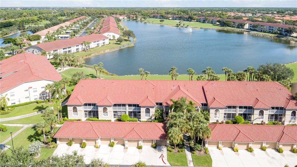 Set on the top floor with no neighbors overhead, this 2-bedroom plus den, 2-bath Veranda condominium looks out across the lake to the golf course. Vaulted ceilings and diagonal-set tile open up the great room and dining area, and sliders lead to a screened balcony facing the water and the fairway. The kitchen offers white cabinetry, solid-surface counters, a glass mosaic backsplash, a breakfast bar and a pantry, and the bay-window breakfast nook frames the lake view. A den with a vaulted ceiling works as an office, media room or extra guest space. The split floor plan places the guest bedroom and full bath on one side and an oversized primary suite on the other, with a walk-in closet and a bath with dual sinks and a glass-enclosed shower. A second screened porch at the entry adds a private outdoor room, and in-unit laundry and a detached one-car garage with an automatic opener round out the home.

Cypress Woods Golf & Country Club is a bundled community, so full golf and social membership comes with ownership. Residents enjoy an 18-hole, par-72 golf course, a clubhouse with a dining room and grille, a heated resort pool and spa, a lap pool, a 24-hour fitness center, eight pickleball courts, tennis, bocce and a putting green. Cypress Trace is gated and has its own neighborhood pools, and the community sits just north of Immokalee Road, minutes from I-75, shopping and dining, with Mercato and the Gulf beaches an easy drive away.