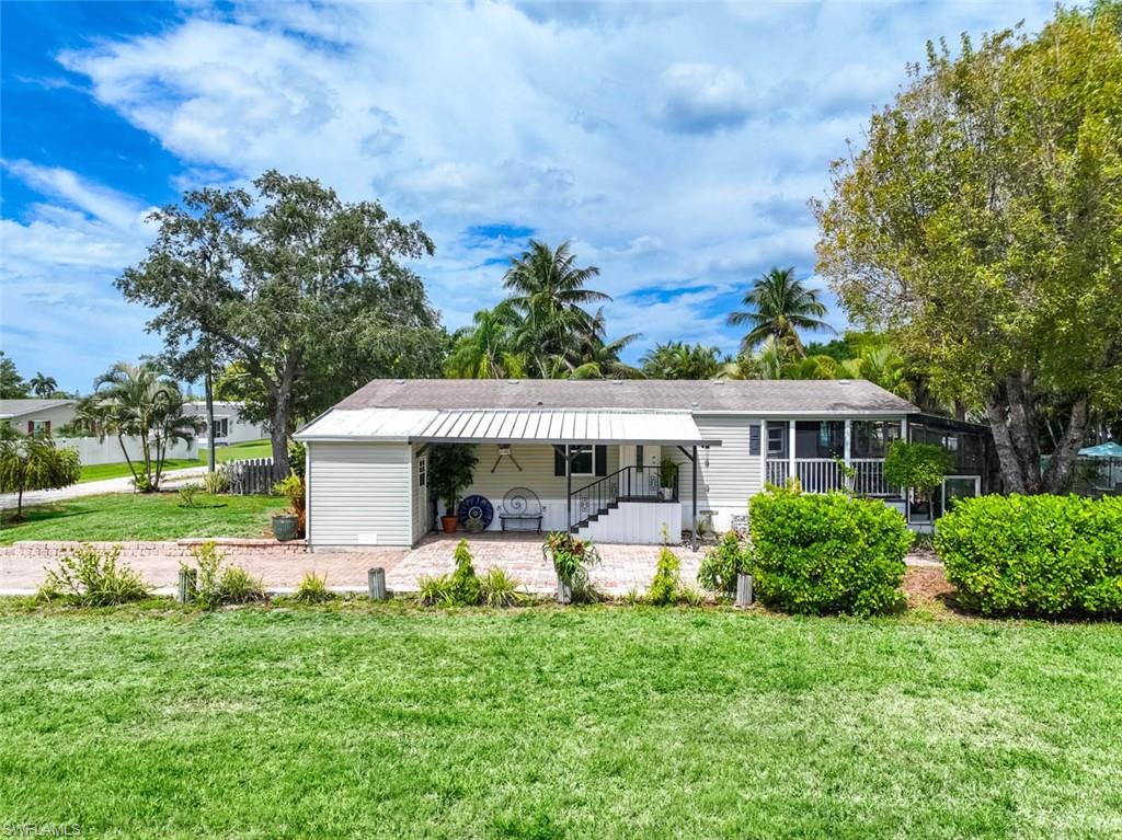 One or more photo(s) has been virtually staged, AI generated or rendered.  Discover a rare WATERFRONT opportunity in the highly sought-after Rookery Bay area. Located on a quiet, private
street with only four homes, this gulf access property offers the ultimate Southwest Florida lifestyle with NO
HOA FEES. This immaculate 2 bedroom, 2 bath manufactured home features soaring 10-foot ceilings, elegant
crown moulding, and a bright open floor plan designed for comfortable living and entertaining. The spacious
kitchen flows seamlessly into the main living areas, creating an inviting atmosphere throughout. Outside, enjoy
your oversized screened-in porch, perfect for relaxing or hosting, overlooking beautifully landscaped grounds
that lead directly to the water. Boating enthusiasts will appreciate the PRIVATE DOCK and BOAT RAMP, providing
direct GULF ACCESS via Henderson Creek. Enjoy world-class fishing right from your backyard and quick boating
access, just minutes to Rookery Bay and approximately 20 minutes to Keewaydin Island. A true hidden gem for
boaters, fishermen, and those seeking a peaceful waterfront retreat—this is Florida living at its finest!