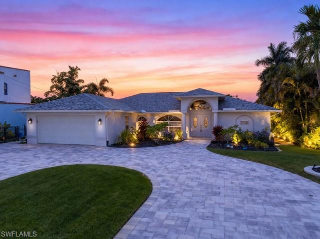 Luxury meets convenience in this Gulf-Access oasis in the highly coveted neighborhood of SW Cape Coral. Whether you’re seeking a year-round sanctuary or a vacation home, this 3-bedroom, 2-bath home checks all the boxes.

Graced with Western exposure and nestled along the picturesque Faye Canal Basin, which spans an impressive 380 feet at its widest point, you’ll be captivated by breathtaking sunsets and endless aquatic adventures to the Gulf right from your private dock and lift. This home has been elevated to the pinnacle of waterfront living with brand-new storm impact windows and doors, electric shutters on the lanai, panoramic screen cage, a new boat dock and lift, and a paved circular driveway. Additional upgrades include plantation shutters, electric window blinds, a completely refinished pool with new tile and finish, a concrete pathway leading to the dock, a brand-new outdoor kitchen, and underwater fish lights that create a magical glow at night as the water comes alive.

Inside, a soothing coastal color palette flows effortlessly throughout the meticulously designed floor plan. The sleek kitchen offers an island and an eating bar overlooking the water, while two separate living areas provide both comfort and functionality. Pocketing sliders open wide to create seamless indoor-outdoor living, and walls of windows flood the interior with natural light, creating a warm and inviting atmosphere.

The spacious pool area, framed by swaying palms and complemented by the new screen enclosure, sets the stage for both entertaining and quiet relaxation. With assessments fully paid and all of life’s daily conveniences just minutes away, including dining, groceries, schools, pharmacies, banking, and more—this home combines luxury with practicality in one of Cape Coral’s most desirable locations.

Don’t miss your opportunity to experience waterfront living at its finest. Schedule your private tour today.