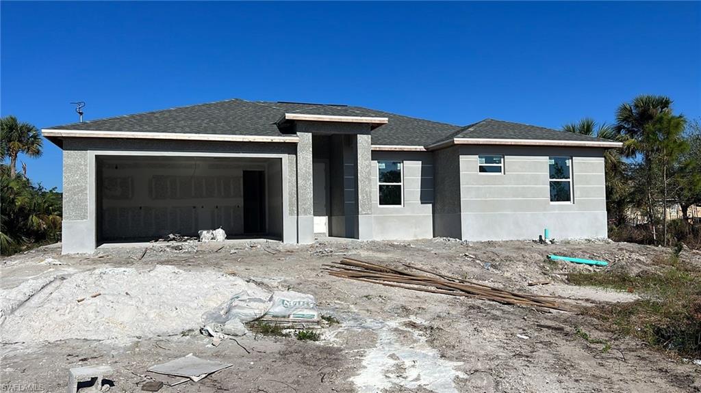 3D WALK THROUGH LINK:  https://mls.kuu.la/share/collection/7qyVq?fs=1&vr=0&sd=1&thumbs=1    Under construction:  IN PORT LABELLE beautiful and SPACIOUS 3 BEDROOMS 2 BATHROOMS. This home was designed modernly with a lot of features: Tray ceilings, lanai under truss, impact resistant windows and doors, all tile floors, floor to ceiling tiled master shower,  8’ interior doors,  9'4" ceiling high,  Stainless steel appliances,  Automatic garage door opener,  ceiling fans in bedrooms great room and lanai,  a nice size laundry room with a sink near the garage.      BUYER INCENTIVE: AT CLOSING, THE BUYERS WILL RECEIVE A 10 YEAR WARRANTY POLICY FOR THE NEW HOME FROM THE SELLER!!! + ADDITIONAL $5,000.00 CREDIT AT CLOSING FOR BUYERS WHO ARE GETTING A LOAN THROUGH A PREFERRED LENDER !!!  ESTIMATED COMPLETION DATE MARCH 2023