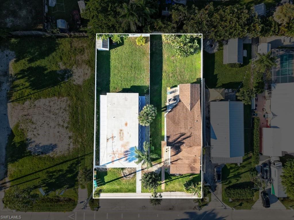 **Exceptional Investment Opportunity in Naples!** Discover this unique income-producing property featuring **five residential units across two buildings on a spacious 0.34-acre lot.** Located at 2631 Becca Avenue, this property consists of a triplex offering three one-bedroom, one-bathroom units and a duplex featuring a three-bedroom, one-bathroom unit and an additional one-bedroom, one-bathroom unit.

Ideally positioned near some of Naples' most exciting attractions and developments, the property is conveniently located near the highly anticipated JW Marriott development and the renowned USOP National Pickleball Center, home to 65 courts and host of the annual US Open Pickleball Championships every April since 2016. Just minutes from the world-class dining, shopping, and entertainment of 5th Avenue South, this location offers exceptional convenience and accessibility.

**With no rental restrictions**, five separate residential units, and a generous lot size, this property offers exceptional flexibility for investors seeking to maximize rental income and explore both short-term and long-term rental opportunities. Its desirable location near major Naples attractions, entertainment, and ongoing development makes this a compelling opportunity to acquire a versatile investment property in one of Southwest Florida's most sought-after markets.