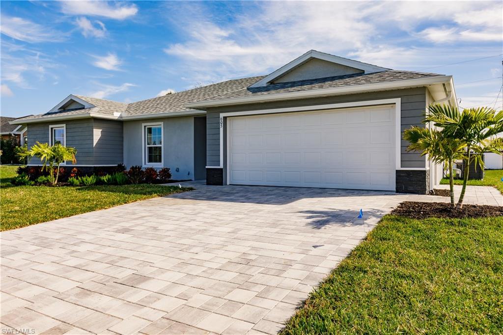 SYNERGY HOMES, a Better House a Better Value! This stunning new construction home has City Water & Sewer and is located in Cape Coral which has some of the highest ratings for quality of life, retirement, outdoor activities, and overall livability. The Cape ranks particularly high in terms of cost of living and safety. With a generous 1,809 square feet of living space, this 4-bedroom, 2-bath home is close to shopping, dining and has plenty of extra room to build a pool just outside your large 10x16 under-truss lanai. This home also includes a generous 2-Car garage with epoxy flooring. ALL at a competitive price! Comes with a full Builders 2-10 warranty. Builder has additional locations available at varying stages of completion.  Call us to set up a time to speak with the Builder to discuss additional concessions as well as other homes available at different stages of completion.
