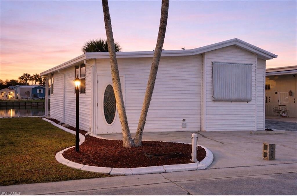 Welcome to resort-style living in Imperial Wilderness, a 55+ active, gated community in Sunny Southwest Florida! This home offers 1 bedroom, a spacious flex area, and 2 full bathrooms, and is being sold furnished for your convenience. The A/C was replaced in 2022, and the home features a durable metal roof. Best of all, you own the land and enjoy low HOA fees of just $898 per quarter. Your quarterly dues cover cable, trash, recycling, water, sewer, and lawn care… making for easy, low-maintenance living. Step out back and enjoy a relaxing pond view. The perfect spot for your morning coffee or unwinding in the evening. The community amenities are second to none, including two pools, a spa, pickleball and tennis courts, bocce, shuffleboard, billiards, ping pong, a nature trail, clubhouse, and even a library. Pet lovers will appreciate the two on-site dog parks (40 lb. max). Plus, this community has never flooded ~ offering added peace of mind. Come enjoy the vibrant lifestyle waiting for you!