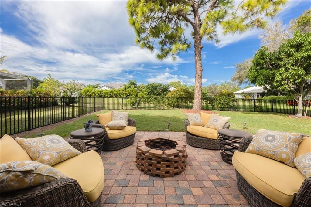 Welcome home to this beautifully maintained 3-bedroom, 2-bath residence in the heart of Naples. Designed for easy Florida living, this home features impact windows and doors, a newer A/C system still under warranty, and new LG appliances.

Inside, enjoy a bright open floor plan with tile flooring throughout and a spacious great room layout. The chef-inspired kitchen includes granite countertops, a pantry, and a breakfast bar that flows effortlessly into the main living space. The primary suite boasts a huge walk-in closet and an updated bath.  Step outside to a fenced backyard overlooking the lake, where the western exposure offers vibrant sunsets. 

Located just minutes from Naples beaches, 5th Avenue, and top-rated schools, this community offers low HOA fees with access to a resort-style pool, tennis, and basketball courts.

Move-in ready and packed with updates—this is the ideal opportunity to enjoy the Naples lifestyle today!
Video tour/walkthrough link available on the MLS
