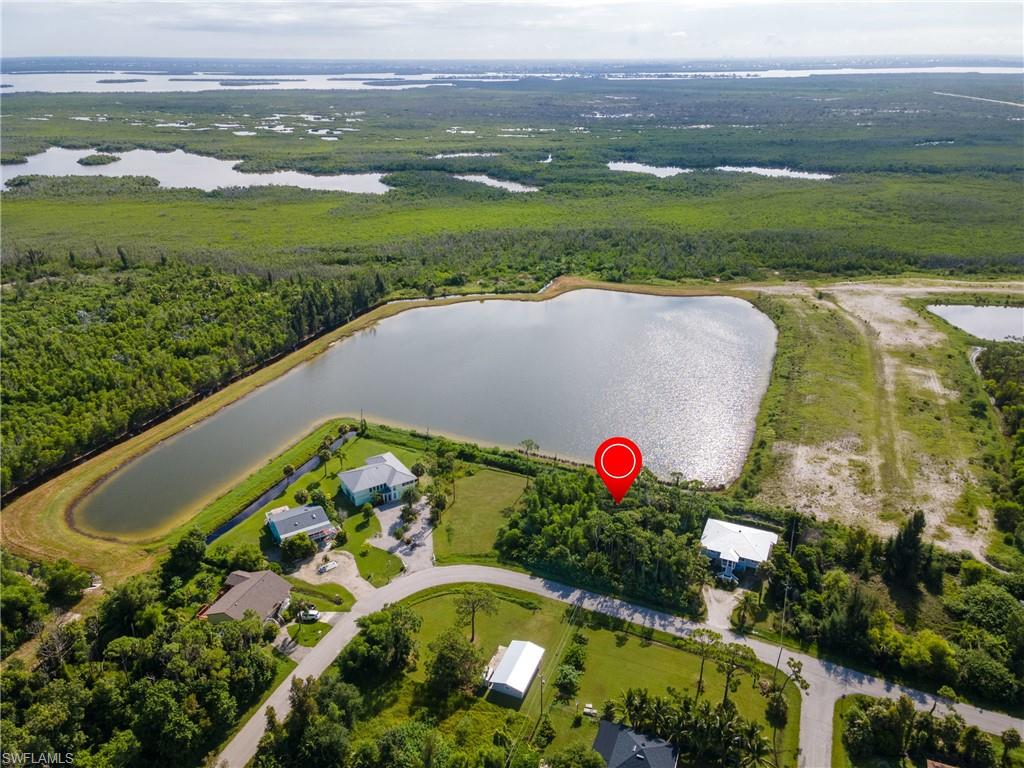 This large double lot offers an exceptional opportunity to build your dream waterfront home in a serene setting with Island living. Conveniently located near the public library, restaurants, and supermarkets, it combines accessibility with tranquility, providing a perfect blend for comfortable living. With friendly neighbors and a peaceful atmosphere, this is a chance you won't want to miss—make your offer today!