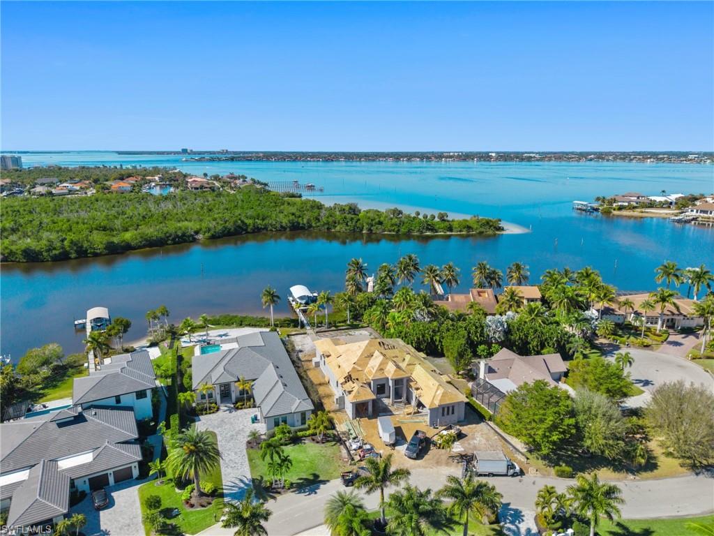 Brand new riverfront luxury home in Town & River Estates is underway by renowned builder Edge Water Development Group! Situated on magnificent Deep Lagoon this premiere waterfront property overlooks a pristine mangrove forest preserved in perpetuity by Lee County Conservation 20/20. Call now to tour this new build as well as examples of completed gulf access model homes constructed by Edge Water. The superior fit and finish of an Edge Water home is immediately obvious to those who know the difference. This 3,674 sq ft great room floor plan features a kitchen of distinction, 4 bedrooms, home office, 4 full bathrooms, 1 half bath powder room, spacious flex dining, and 3 garage spaces. The primary retreat is worthy of the personal space on planet earth where you spend 40% of your life’s valuable hours. An elegant bedroom, 2 walk-in closets, dual vanities, freestanding tub, and walk through shower with linear drain.  Outdoor living is at its finest here with two covered areas, summer kitchen, elegant heated pool, integrated spa, wrap-around dock, and canopied boat lift currently deploying a 40ft SeaVee center console with triple 400s. This perfect new construction opportunity checks all the boxes including Town & River Estates, river frontage, Deep Lagoon, sunset view, mangrove preserve, and deep-water moorage for boating. There is only one available, so call now to learn more.