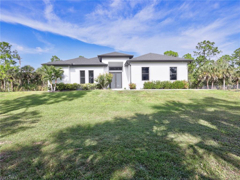 BEAUTIFUL NEW LISTING - 100% UPLANDS!! Move in ready! This beautifully built 3 bedroom + den, 2.5 bath home sits on a 100% upland 2.5-acre lot just off 16th St NE in Golden Gate Estates. Featuring 1,900 sq. ft. living and 2,627 sq. ft. total, this property offers the perfect blend of space, upgrades, and privacy. Enjoy a 2-car garage, 24x24 porcelain tile, crown molding, quartz counter tops, solid wood cabinets, and stainless steel appliances. The living room and primary suite include tray ceilings, while the primary wing offers an over-sized bedroom, two walk in closets, a double vanity, and a glass-enclosed shower.
Outdoor features include a large lanai, beautiful landscaping, automatic sprinkler system, and impact-resistant windows and doors. The backyard is newly fenced with black chain link fence. This house is a fantastic value in a prime Estates location close to the new expansion of Vanderbilt opening soon.
*Don't miss out on the virtual tour*