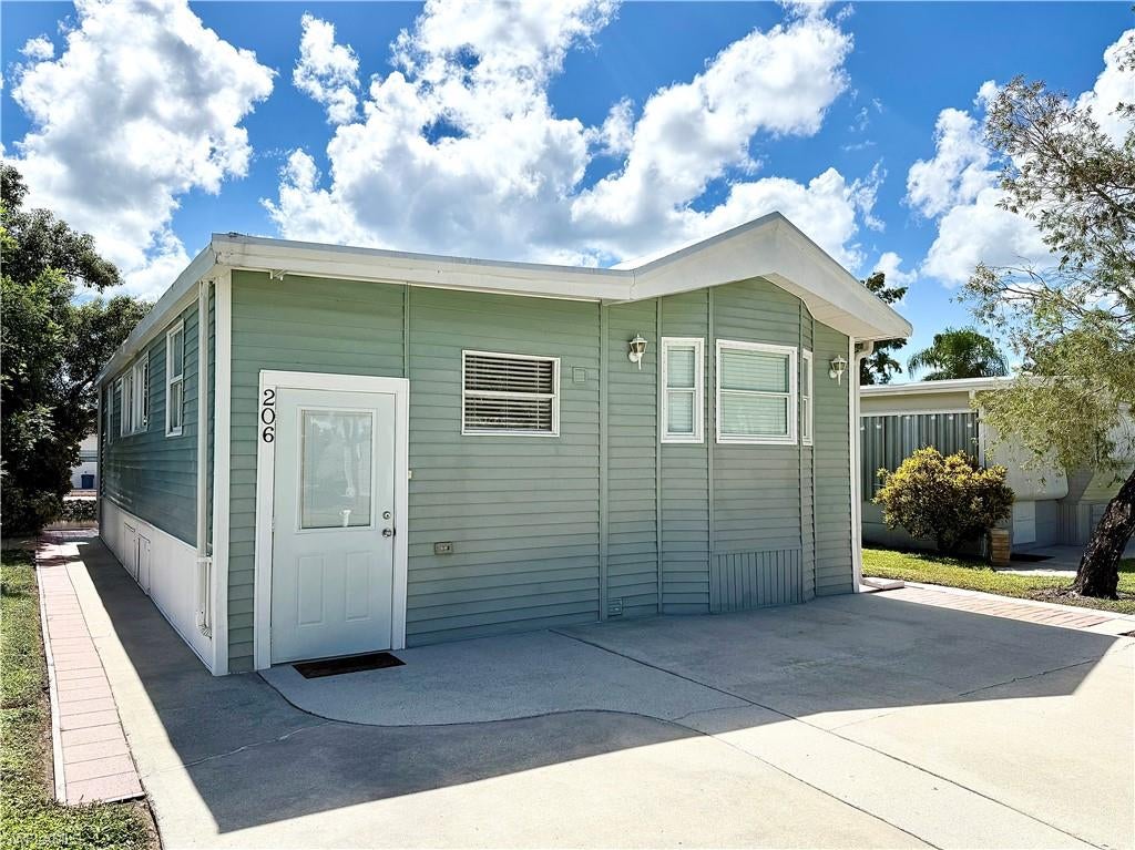 Get ready to OWN YOUR OWN LAND when you purchase this Naples, FL home in a gated 55+ community that was never flooded! This 1Br/1.5Ba home is located in the Imperial Wilderness Condominium Association— an active community of 546 individually owned properties (not a co-op or land lease). This particular home, 206 Cheetah Drive, features vinyl siding, a roof-over, rear patio with water view, large kitchen, and 2 sleeper-sofas (home is being sold furnished). Additionally, you’ll appreciate the laundry area that affords ample storage space. Within the neighborhood, the property is an extremely short walk to access the mail/office building and within close proximity to both the clubhouse area and second pool area. IWCA is located approximately 3 miles to shopping and restaurants, 11 miles to the Naples beaches, and 8 miles to the Marco Island beaches. Airport access is also easily attainable— a 45-minute drive (RSW). Maximizing the opportunity to affordably own property in Naples, FL, the HOA fee of $898. per quarter is exceptionally reasonable. That fee covers many of your needs: the advantage of a gated community, water, sewer, lawn care, basic cable, trash, recycling, and community amenities. Community amenities include 2 pools with spas, bocce, pickleball, pétanque, tennis, shuffleboard, billiards, ping pong, a library, clubhouse, 2 dog parks (1 pet, 40lb. max.), and a nature trail. Electric golf carts are allowed in this community and there is an extremely active events calendar.