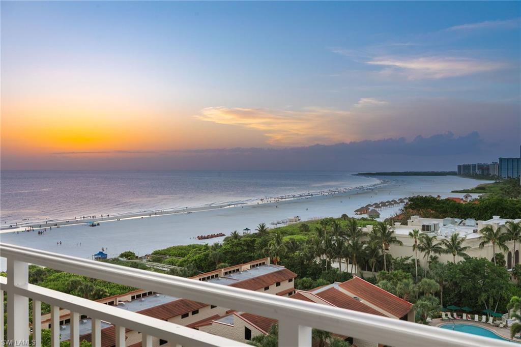 Positioned along Marco Island's iconic crescent-shaped shoreline, this fully reimagined 11-floor end residence captures commanding 90-degree views of the Gulf and city skyline. With 2,193 square feet of interior space and four private balconies—one for each bedroom—this three-bedroom, three-bath residence offers seamless indoor-outdoor living from every vantage point. Completed in early 2025, the meticulous renovation showcases large-format tile throughout, a reconfigured kitchen with quartz countertops and backsplash, new appliances, upgraded baths, a new electric fireplace and extensive custom storage. Impact-resistant sliding glass doors and windows, paired with accordion shutters on all balconies to provide double storm protection. The open-concept layout is designed to maximize natural light, coastal breezes and captivating sunset vistas. This prestigious beachfront building features a soaring three-story atrium lobby, private beach access and resort-style amenities such as a heated pool and spa, fitness center with sauna, tennis and pickleball courts, social room, library, grilling cabana, and ButterflyMX security. On-site management and weekday front desk service offer unmatched convenience. One assigned covered parking space is included. Ideally near the JW Marriott, Hilton and Marco Walk Plaza, this residence delivers a rare blend of tranquility, sophistication and accessible luxury.