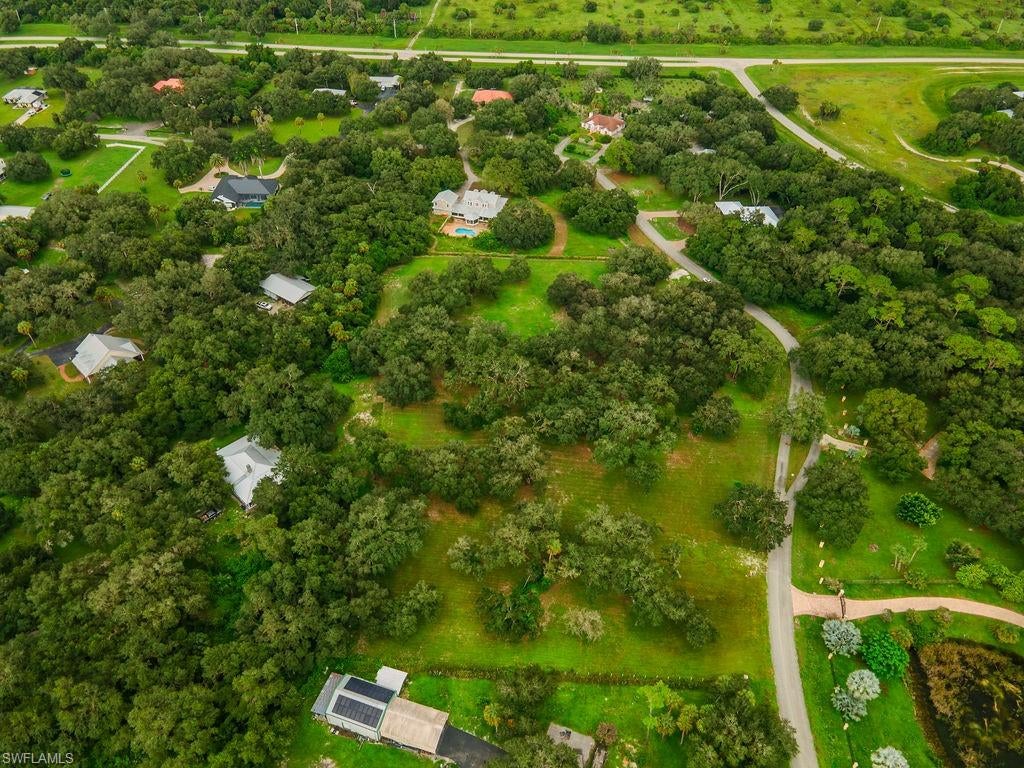 THIS is the kind of property you don’t come across every day! Nearly 3 acres of high, beautiful land just minutes from LaBelle, framed by 15+ magnificent American oak trees—some believed to be 200–300 years old. The result is a breathtaking, naturally shaded setting with the privacy and character that takes generations to create. A large, cleared and level homesite is already positioned among the oaks, giving you the perfect opportunity to design a custom home while preserving what makes this property so special. Imagine a pool beneath the trees, expansive outdoor living spaces, gardens, or your own private retreat. An established driveway, private well with pump and pressure tank, plus mature avocado and plum trees are already in place. Underground electric and city water are available in the area. Surrounded by beautiful custom and estate homes and located approximately 2–3 miles from town, this is your opportunity to enjoy acreage living without sacrificing convenience. Bring your plans—the setting is already here.