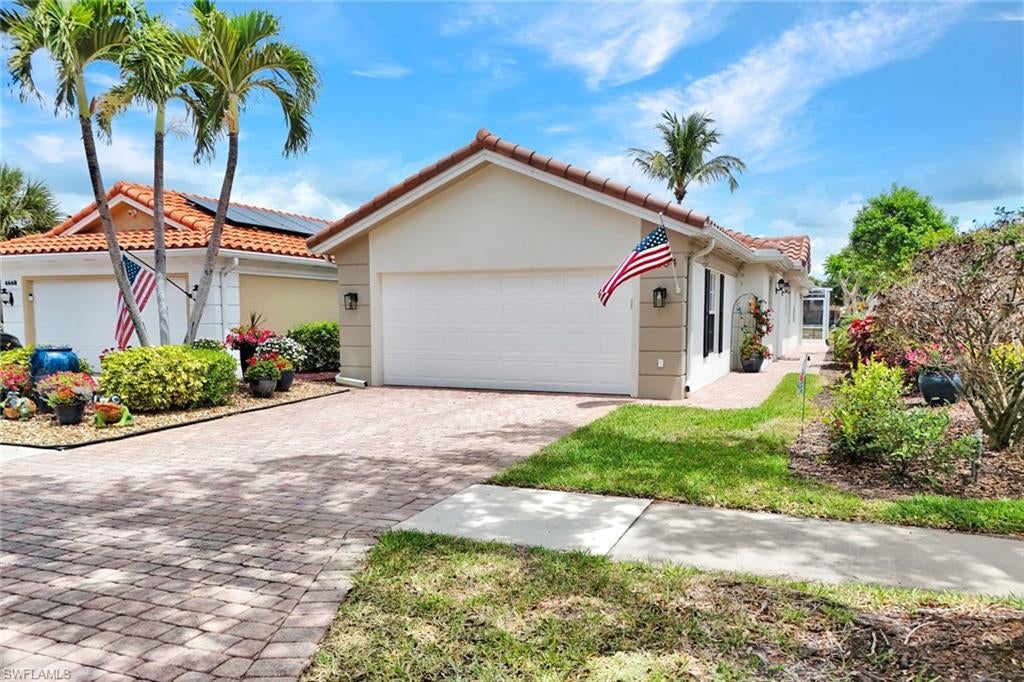 This Beautiful IslandWalk Home Features a NEW ROOF** **NEW A/C**  Capri Model Home with 2 Bedroom plus open Den 2 Bathroom and 2 Car Garage. Your popular Open Floor Plan is great for entertaining and offers easy maintenance. This Bright Open Kitchen includes Quartz Countertops and Stainless Steel Appliances, Updates include luxury vinyl wood flooring, Great Wall Unit, Home has been painted, commercial grade epoxy garage floor and generator. Relax and enjoy your time both indoors and outdoors around your Pool. This energy-efficient home is part of the Guard-Gated Award-Winning community of Island Walk. Amenities include heated Resort & Lap Pools, State-of-the-Art Fitness Center, lighted Tennis, Pickleball and Bocce Courts, Putting Green, Fantastic Casa Cotzelli Restaurant, Post Office, Car Wash, Gas Pumps and Nail and Hair Salon. This exceptional buy includes Lawn/Landscaping/Irrigation Care and HDTV & High-Speed Internet in the LOW FEES. All this and located a short drive to Naples white sand Beaches and exceptional Dining and Shopping.Come and see for yourself what Resort Living is like!