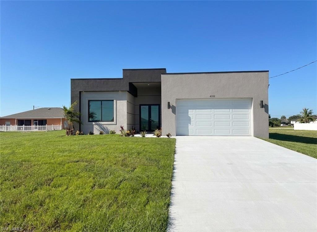 Beautiful Lot home, make it yours now! Bright and spacious property in a prime location, offering a peaceful residential setting with quick access to green areas and outdoor recreation. Discover this stunning, move-in-ready new construction home offering 1737 sq ft of living area located in the fastest-growing area of Cape Coral. Featuring a sleek contemporary layout with 10-foot ceilings and elegant tile flooring throughout, this residence boasts 4 spacious bedrooms and 3 stylish bathrooms. Enjoy a gourmet kitchen with white cabinetry, quartz countertops in both the kitchen and bathrooms, and stainless steel appliances. Bathrooms feature frameless glass-enclosed showers/bathtubs, adding a luxurious touch. A washer and dryer are also included for your convenience. The open floor plan seamlessly connects living, dining, and kitchen areas, while the private backyard offers a peaceful retreat. Built with Stem Wall foundation for enhanced elevation and structural strength, this home also features impact-resistant windows and doors, automatic garage door, irrigation system, and high-end finishes throughout. This property is ideal for families, snowbirds, or investors. Plus, it includes a builder’s warranty 2-years and 10-year structural coverage offering peace of mind for years to come. Don’t miss this incredible opportunity to own a high-quality home in a booming location!-WITH SHELVES, FILTER AND BLINDS