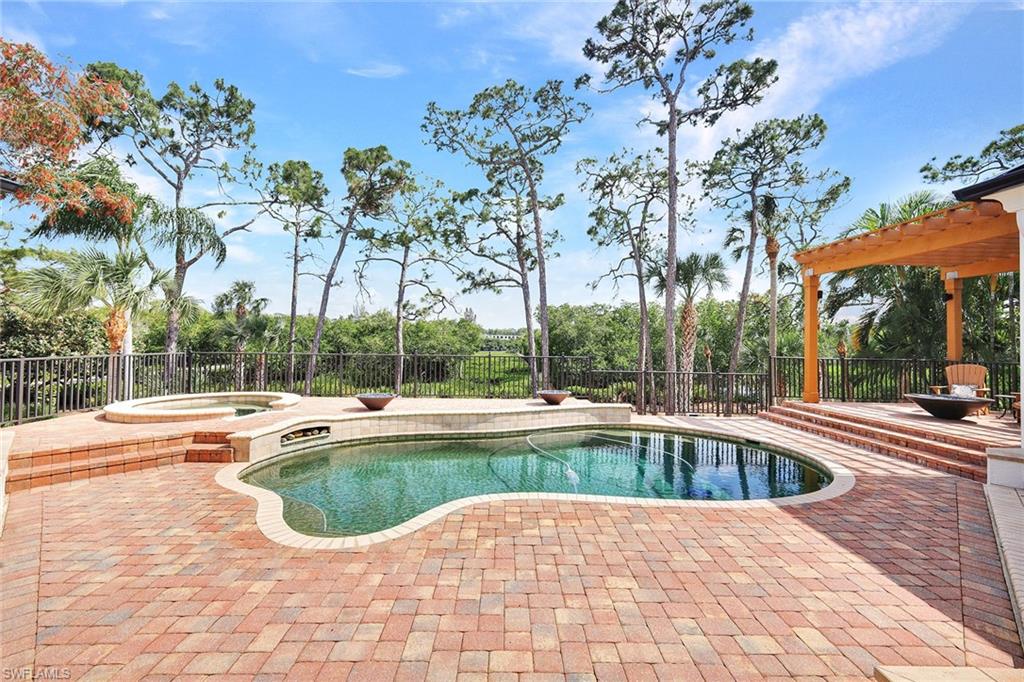 NOW PRICED UNDER APPRAISED VALUE! Prepare to be captivated by this reimagined masterpiece in Bonita Bay, where modern luxury meets timeless design. Boasting exceptional curb appeal, the home showcases a brand-new $150,000 metal roof, a freshly painted exterior, and lush tropical landscaping that sets the tone for what’s inside.

Perfectly positioned with a sought-after southeastern exposure, this residence offers an extraordinary outdoor living experience overlooking pristine mangroves and the tranquil Imperial River. The private outdoor oasis features an inviting pool and spa, dramatic gas fire bowls, a cozy fire pit, and a fully equipped outdoor kitchen—ideal for entertaining or quiet relaxation. A private fishing pier extends directly to the river, completing this serene retreat.

Inside, every detail reflects the artistry of Collins & Dupont Design Group, blending comfort and sophistication throughout. The gourmet kitchen impresses with a gas cooktop, ice maker, wine cooler, dual dishwashers, and sleek 2019 appliances. Thoughtfully designed for both family living and entertaining, the home includes four bedrooms plus a den, 4.5 baths, including a private cabana suite—perfect for guests. Elegant volume ceilings, multiple outdoor terraces, and an oversized three-car garage enhance the sense of space and style.

Additional highlights include a whole-house generator for peace of mind and meticulous maintenance by the original owners.

As part of the prestigious Bonita Bay community, residents enjoy over 12 miles of scenic trails, three parks, pickleball, and a full-service marina—an unparalleled lifestyle surrounded by nature, beauty, and convenience. Choose to enhance your lifestyle with Bonita Bay’s exclusive membership options. Whether you’re an avid golfer, tennis player, fitness enthusiast, or simply enjoy relaxing by the pool, you’ll find world-class amenities that rival the finest clubs in Florida.