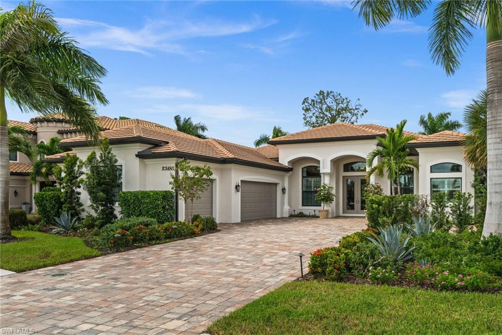 Professionally designed and upgraded with sophisticated finishes, thoughtfully curated details, and an exceptional attention to detail throughout, this stunning residence in the heart of Bonita Lakes showcases designer lighting, elegant wallcoverings, custom window treatments, and an extensive collection of interior and exterior enhancements. Offering 3 bedrooms plus a den, 3 bathrooms, and a spacious three-car garage, the home features an inviting open floor plan complemented by volume ceilings, decorative tray accents, and crown molding. Designer wallpaper, elegant drapery, custom shades and shutters, and updated lighting fixtures with dimmer controls create a refined, cohesive aesthetic throughout the interior. Freshly painted from top to bottom, the home also features refinished cabinetry with updated hardware, new plumbing fixtures, and new carpeting in the guest bedrooms. The spacious kitchen offers granite countertops, stainless-steel appliances, a gas cooktop, pantry, and generous counter seating, complemented by a beautiful new marble island that conveys with the home. The primary suite features two walk-in closets and a well-appointed bathroom with dual vanities, granite countertops, a soaking tub, and separate glass-enclosed shower. Outdoor living is equally impressive, with a spacious screened lanai featuring a heated pool with waterfall feature, retractable electric awning, and gas firepit, all surrounded by beautifully refreshed landscaping and new exterior landscape lighting. Additional improvements and features include two new HVAC systems with UV protection (2025), newer pool heater and pump (2024), complete exterior painting, a new glass front French door, new washer and dryer, integrated surround sound, and whole-home surge protection. Impact-resistant windows and doors, a Generac whole-house generator, and a desirable Flood Zone X location offer added protection and peace of mind. Bonita Lakes is a gated community offering a clubhouse, resort-style pool and spa, fitness center, tennis courts, bocce, and no CDD. Bonita Lakes is conveniently located near shopping, dining, Coconut Point, Southwest Florida International Airport, and the Gulf beaches.