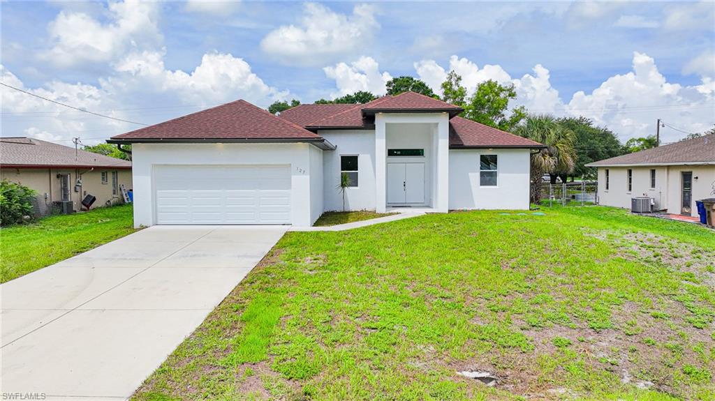 Your Florida dream home is here! This beautiful new construction home combines modern style, functionality, and a convenient location in Lehigh Acres.

Featuring 3 bedrooms plus a versatile den, this home offers plenty of space for everyone. Use the den as a home office, playroom, gym, or even a guest space—the possibilities are yours!

Step inside to discover beautiful tile flooring throughout, modern finishes, and a bright, open-concept living area designed for both everyday living and entertaining. The spacious layout creates the perfect place to gather with family and friends.
