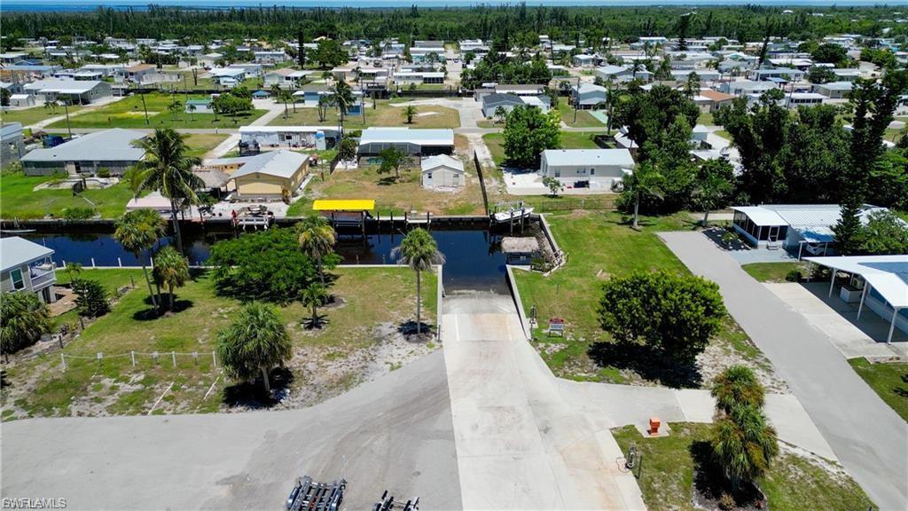 Build your ideal island retreat on this affordable 50x80 residential lot located in the desirable 55+ community of Pine Island Cove. This friendly, well-maintained neighborhood offers a relaxed coastal lifestyle with low monthly fees and excellent amenities.

The lot features .09 acres (4,008 sq ft) with east rear exposure, grass ground cover, and no trees, making it easy to design and place your new home. Manufactured homes and single-family homes are permitted, and the property is serviced by central water, private sewer, underground utilities, and cable.

Residents enjoy a heated saltwater pool, spa, clubhouse, pickleball, bocce, picnic areas, and boat/RV storage. The community is known for its active social atmosphere and convenient location near boating, fishing, and the natural beauty of Pine Island. This is a great opportunity to secure a buildable lot in a popular 55+ community with a low $80/month HOA and easy access to all that island living offers.