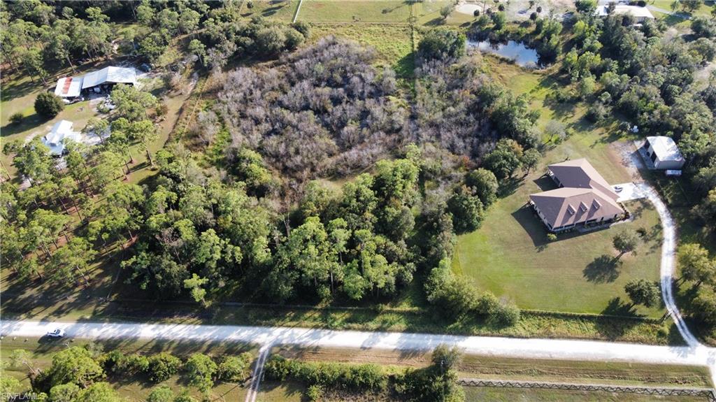 Rare opportunity. Almost 5 acres right off of Nalle and Nalle Grade Rd. Beautifully wooded lot with a small pond, fully fenced with gate access already in place. Build your farmhouse and bring your animals to this country setting. Just five minutes to I-75, 20 minutes to Southwest Florida international airport, 30 minutes to Punta Gorda Airport Multiple Publix grocery stores within 10 minute drive. Wetland determination, buyer will have to work with ERP and/or SWFWMD to mitigate location to build a single family home.
