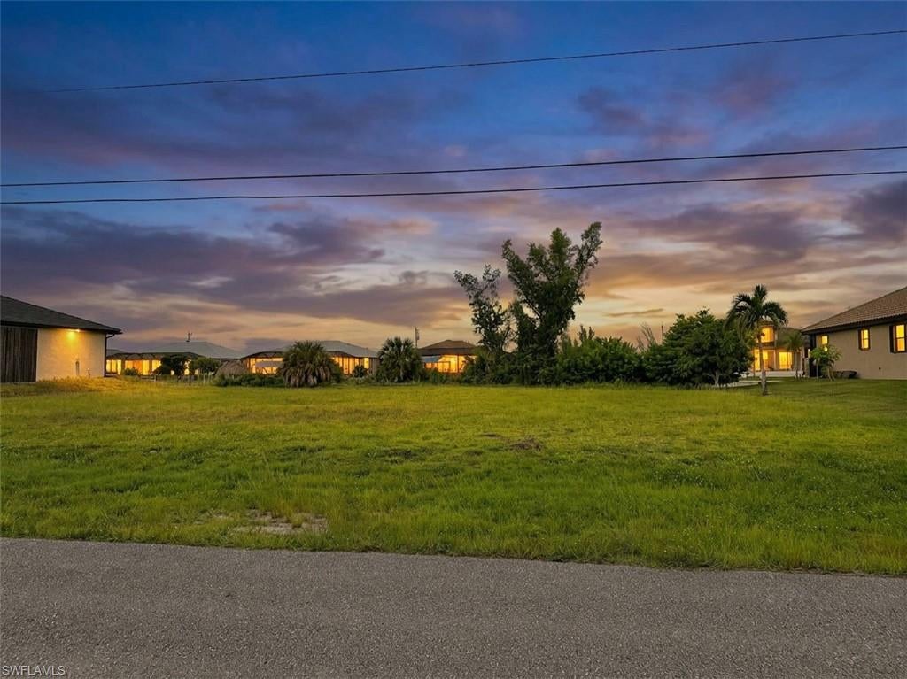 One or more photo(s) has been virtually staged, AI generated or rendered.  Build your waterfront dream home in Northwest Cape Coral! This oversized Gulf-access canal lot offers approximately 0.34 acres / 14,985 sq. ft. of cleared land, providing extra room to design a custom home, pool, outdoor living space, and waterfront improvements to fit your vision.

Positioned along a residential canal surrounded by established homes, the property features a desirable west-northwest canal exposure of approximately 300°, providing beautiful afternoon light and sunset-oriented views from the future rear of the home and waterfront area.

For boaters and anglers, the canal system provides access toward Matlacha Pass, Charlotte Harbor, and the Gulf, putting Southwest Florida's boating, fishing, islands, and waterfront lifestyle within reach. The location also offers convenient access to Matlacha and Pine Island, along with nearby dining, shopping, parks, golf, and everyday conveniences.

The lot is cleared and ready for your plans, with no seawall currently installed—giving a buyer the opportunity to incorporate the waterfront into the design of their future property, subject to permitting and applicable requirements.

Oversized waterfront land. Gulf access. Sunset-oriented exposure. Build the Southwest Florida lifestyle you've been looking for.