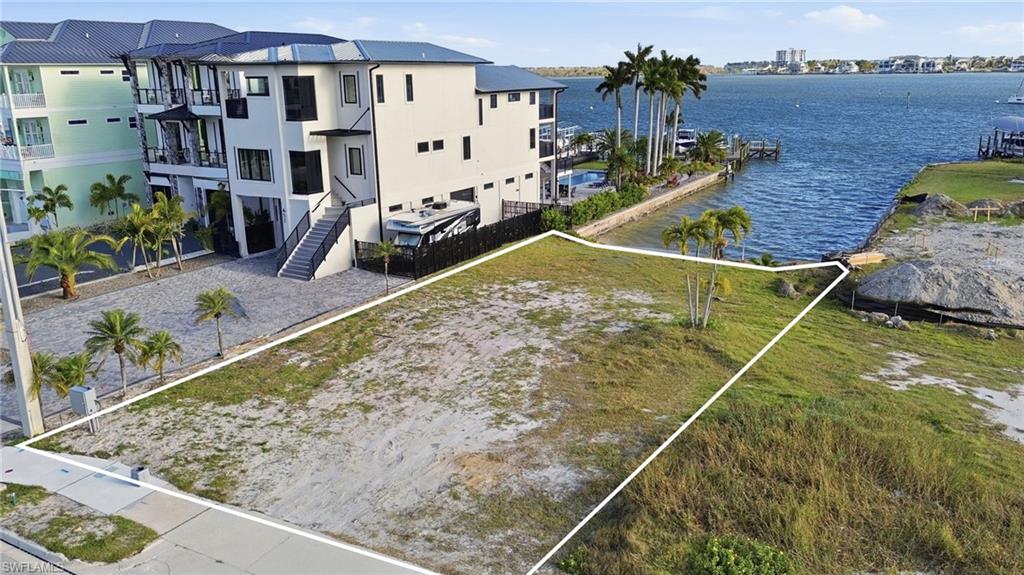 Price just reduced!

Discover one of the most desirable bayfront opportunities near Bowditch Point Park on the far north end of Fort Myers Beach. This property offers wide views of the Bay, and the beach is just across the street with an easy walk to the vibrant Times Square district, where restaurants, pubs and entertainment abound. Boaters will appreciate the quick access to the open Gulf Waters.

Located in a weekly rental zone, this property also presents a valuable investment opportunity for owners interested in generating income through a rental program once a home is built.
  
With its rare combination of bayfront tranquility, Gulf proximity, walkability, and panoramic views, this property stands out as one of the most exceptional waterfront offerings on Fort Myers Beach. A perfect canvas for your dream coastal home.