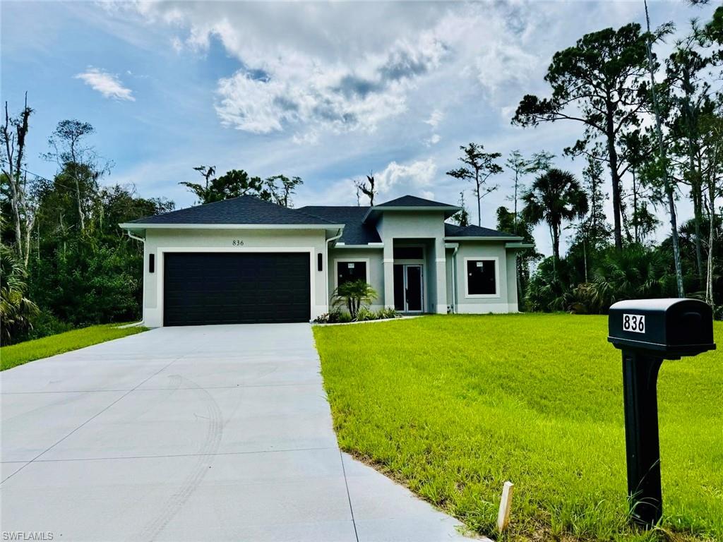 Welcome to this beautiful brand-new home ideally located in the heart of Lehigh Acres! This spacious 3-bedroom, 3-bathroom residence offers a thoughtfully designed layout with plenty of comfort and flexibility. One of the bedrooms features its own private entrance and bathroom, making it an ideal mother-in-law suite, guest quarters, or private space for extended family. The home features tile flooring throughout, an open and inviting floor plan, and a spacious open lanai with tile flooring—perfect for relaxing or entertaining guests. With modern finishes and a brand-new construction feel, this home is move-in ready and designed for today’s lifestyle. Conveniently located close to banks, restaurants, Publix, shopping, and many other everyday amenities, this property offers both comfort and convenience. Don’t miss the opportunity to make this beautiful home yours!