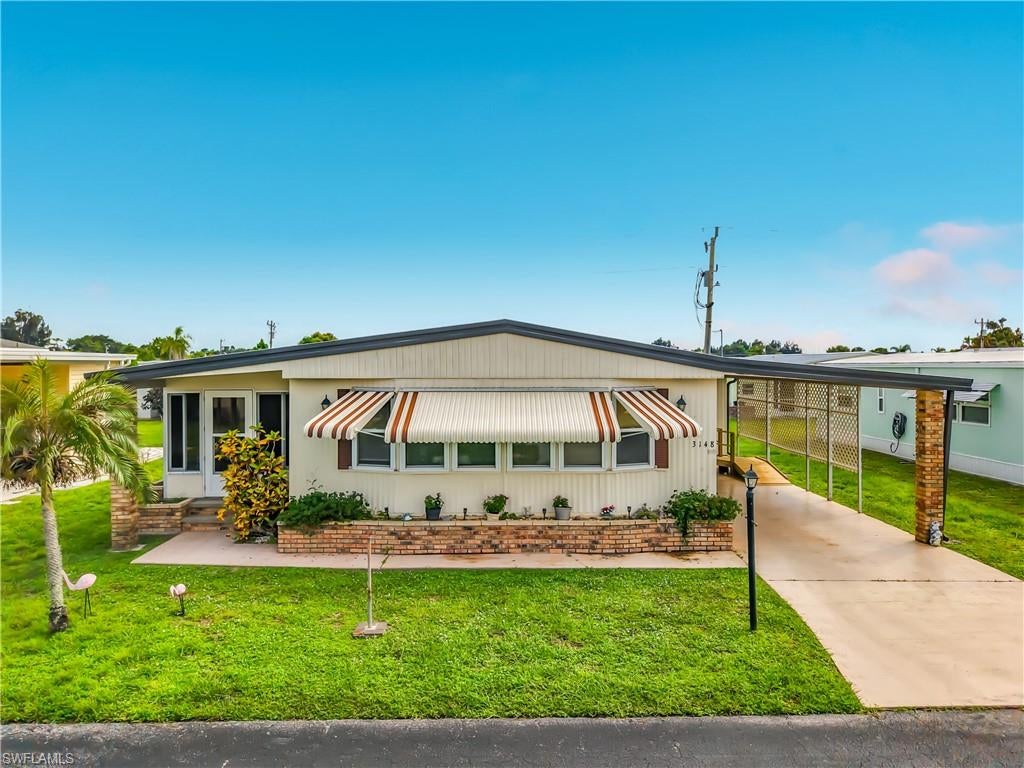 LAND OWNED, LOW HOA OF ONLY $126 PER MONTH, AND NOT IN A FLOOD ZONE! Welcome to Lake Arrowhead, a desirable 55+ community known for its VERY ACTIVE FLORIDA LIFESTYLE, friendly atmosphere, social activities, and outstanding value.

This spacious 2-bedroom, 2-bath home offers approximately 1,276 sq ft under air with a flexible floor plan and plenty of room to relax and entertain. The home features a large living room, enclosed front lanai, and an additional screened solarium, providing multiple indoor and outdoor living spaces.

The updated kitchen features granite countertops, newer cabinetry, black appliances, and luxury plank flooring. Both bathrooms are generously sized and feature walk-in showers. A separate utility area includes a washer and dryer, plus convenient two-car parking at the front of the home.

Lake Arrowhead is perfect for buyers looking to enjoy a VERY ACTIVE SOUTHWEST FLORIDA LIFESTYLE. Residents enjoy a heated community pool and spa, clubhouse, fitness center, billiards, bocce, shuffleboard, library, fishing pier, boat and RV storage, plus a variety of organized social activities and opportunities to connect with neighbors throughout the year.

Conveniently located near shopping, restaurants, Downtown Fort Myers, the River District, major roadways, and Southwest Florida attractions. With LAND OWNERSHIP, an HOA of only $126 per month, no flood zone, excellent amenities, and an active social lifestyle, this home offers exceptional value for year-round living or a seasonal Florida getaway!