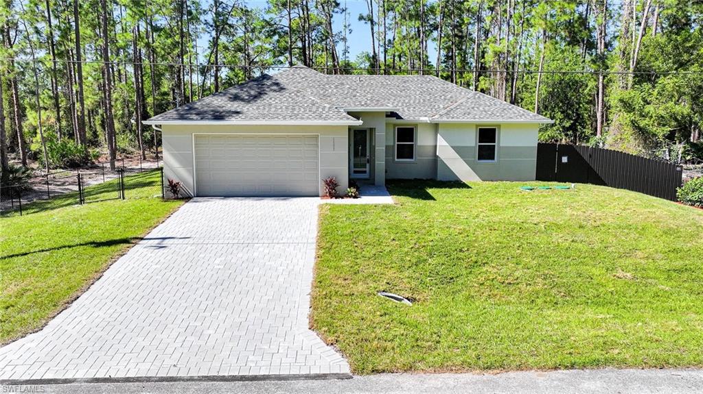 PRICE REDUCED TO MOVE! BRAND NEW CONSTRUCTION ON A 1/2 Acre Lot With A Fenced-In Back Yard! You Will Be Amazed By The Quality Of This Brand New 3 Bedroom/2 Bathroom/2 Car Garage Home With Western Exposure For Those Amazing Painted Florida Sunsets On An Oversized 1/2 Acre Lot In Lehigh Acres, FL. This Home Has 1285 SF Under Air And It Is COMPLETELY Finished With Its CO Issued! You Can Move Into It Today Or Use It As A Cash Flowing Rental Unit (High Demand). The Gourmet Kitchen Comes With Quartz Countertops, STAINLESS STEEL APPLIANCES, White Real Wood Shaker SOFT TOUCH Cabinet Doors & Drawers, Glass Tile Backsplash, Floor To Ceiling Pantry, And A Large Breakfast Bar. Other Upgrades Include; FREE BRAND NEW WASHER AND DRYER WITH PURCHASE OF THIS PROPERTY, HURRICANE IMPACT WINDOWS AND DOORS, Glass Back Door To Let In More LIGHT, Large Designer Porcelain Tile Flooring Throughout Entire Home, PAVER DRIVEWAY, High Ceilings, Large Living Room, Upgraded Baseboards, Large Dining Area, Custom Interior/Exterior Two-Tone Paint, Custom Ceiling Fans/Lights, Large Walk-In Closets, Quartz Countertops In The Bathrooms Along With Accent Tile Over The Tub Areas, New Landscaping Package With Fenced-In Back Yard And Privacy Hedge, Western Exposure For Those Beautiful Florida Sunsets, Epoxy Coating In The Garage And On The Open Covered Lania, And A Laundry Room Including A New Washer And Dryer Inside The Home. This Home Is Close To Regional Shopping Malls, Golf Courses, Interstate I-75, Regional Airport, FGCU, Restaurants, Schools, Golf Courses, MLB Spring Training Baseball, Outdoor Parks, Boat Ramps, Amazing Fishing, And Those Amazing White Sand Beaches Of The Gulf Of America