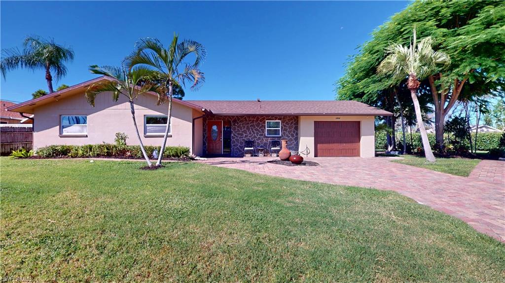 One or more photo(s) has been virtually staged, AI generated or rendered.  One or more photo(s) has been virtually staged, AI generated or rendered. 
STUNNING COMPLETE REMODELED ($150,000+/-) 3 BEDROOM, 2 BATH FAMILY HOME! New A/C system installed September 2026. New roof was replaced June of 2025. Open floor plan with WOOD "WOOD PLANK" VINYL FLOORING throughout the entire home for easy maintenance and bathrooms have tile flooring. Lots of glass windows makes the home LIGHT-BRIGHT-SUNNY all year round. ALL WINDOWS ARE "IMPACT STORM RESISTANT" for total resident comfort. "CHEFS" Kitchen with all WOOD CABINETS, GRANITE TOP COUNTERS, GE STEEL APPLIANCES, TILE BACK-SPLASH & CENTER ISLAND WORK STATION AND EAT-AT-BAR. All doors have custom wood casing finishes and home has baseboards throughout the home. Master Bath has huge vanity and huge all glass & tile SCHLUTER CUSTOM SHOWER SYSTEM ( two hand held, rain head and additional waterfall system). Additionally the home has been set up for GENERATOR, with the transfer switch and transfer box already installed. Welcome to a rare opportunity in the heart Bonita Springs, in a highly desirable no HOA community. . Unlike most properties at this price point, this offering provides immediate usable land with no HOA restrictions. Inside, the fully renovated residence showcases continuous luxury throughout for a seamless, modern aesthetic with everyday durability. Outdoor living is equally impressive, with a screened lanai and paved rear deck creating ideal spaces for entertaining or unwinding. The paved driveway and additional side parking easily accommodate multiple vehicles. Additional upgrades include a whole-home surge protector, generator transfer switch, extra 200V outlets suited for RVs or specialty equipment, a two-drawer refrigerator in the laundry room, and an exterior camera system for added peace of mind. This is more than just a home and it could be in the future a double-lot opportunity in a prime Bonita Springs location, just minutes from beaches, shopping, dining, and entertainment. Own the home. THE HOME COMES WITH ONE YEAR COMPLETE HOME WARRANTY FOR TOTAL BUYER COMFORT!