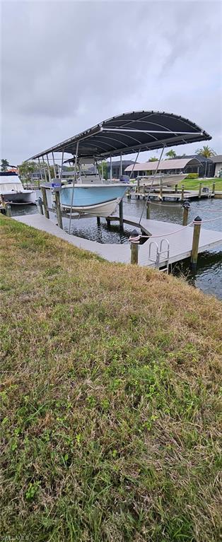 Now is the time to own a piece of paradise!! Rare Find! No Bridges, No Locks and only 2.4 miles to the open water. The seawall is in place and this home-site is ready for you to build the custom home of your dreams! The neighborhood is prime and screams pride of ownership. The location to Cape Harbour, Tarpon Point and the Rose Gardens is highly desirable!! Don't miss out on this opportunity. This property will not last long at this price.