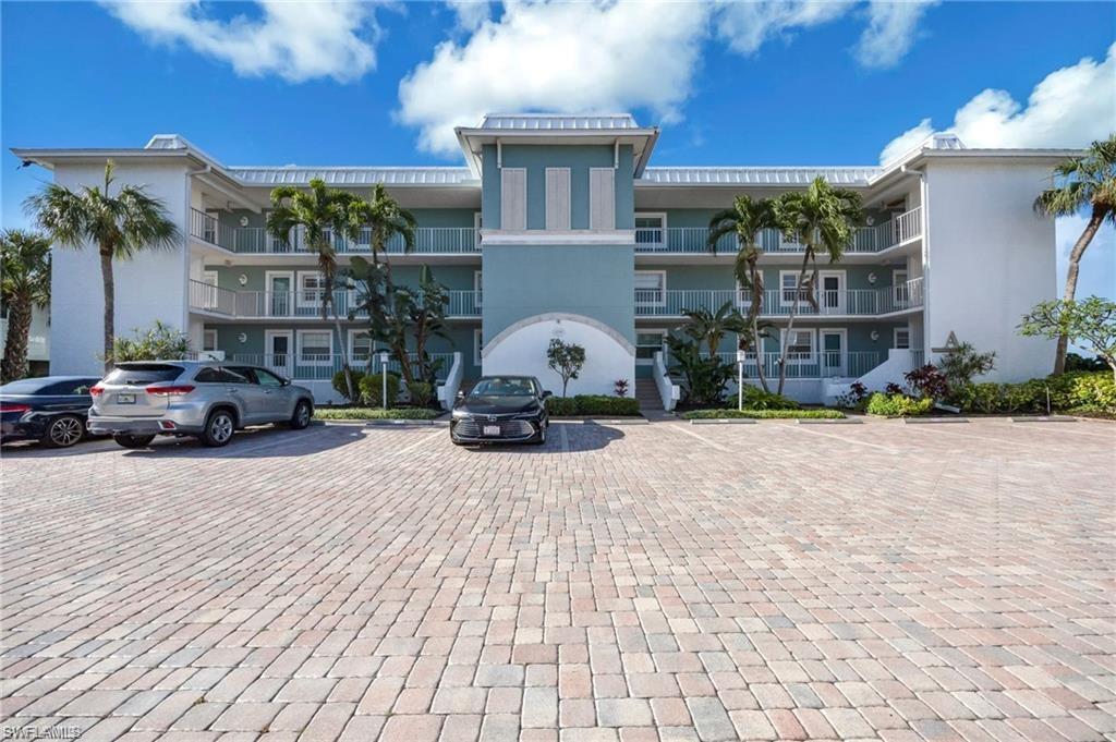 Welcome to your Waterfront Escape with BOAT DOCK. This beautifully maintained first-floor, 3-bedroom, 2-bathroom turnkey furnished condo offers the perfect blend of comfort, convenience, and coastal living. Step inside to find a bright, open layout with tasteful furnishings throughout, making this home truly move-in ready. This spacious living and dining areas flow seamlessly to a screened lanai, where you can relax and enjoy tranquil canal views and gentle breezes. The kitchen is well-dashed appointed, with ample cabinetry and counter space, ideal for both everyday living and entertaining. The primary suite features a private bath and generous closet space, while two additional bedrooms provide flexibility for guests, a home office, or family living. What truly sets this property apart is the included deeded 25ft boat dock with lift, offering direct canal access - perfect for boating enthusiasts looking to get on the water with ease. Additional highlights include convenient first-floor access, elegantly furnished for immediate enjoyment or rental potential, laundry in residence, assigned parking, and peaceful waterfront setting. Whether you're seeking a fulltime residence, seasonal retreat or investment opportunity, this condo delivers the ultimate Florida lifestyle -just minutes from open water and dining and shopping on 5th Ave, 3rd Street, and Bayshore Drive. Boat, relax, and live the waterfront Dream!