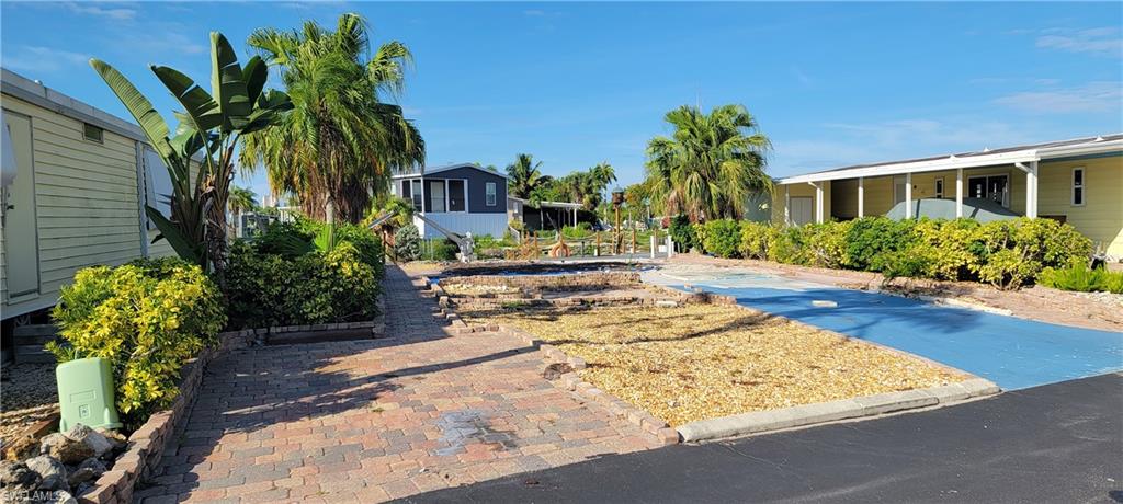 Bonita's Best Kept Secret Community offers owned land and low fees with great location! This vacant lot is a blank canvas for you to build your dream home, whether you chose  a manufactured, modular, wood framed, or block-built design - the Spring Creek Village ARC guidelines are available to get you started. Located just minutes from ESTERO BAY and the GULF OF MEXICO, this canal lot invites you to explore  the waterways. Spend endless boating days fishing, watching dolphins, manatees, shelling, walking the beaches, or simply soak in the serenity of waterfront living. With low HOA fees and abundant amenities, including basketball, BBQ/picnic area, billiards, bocce court, boat storage, clubhouse, community boat dock and ramp, community park, community pool/spa, fishing pier and cleaning station, library, pickleball, shuffleboard, tennis courts, and free kayaks for residents, friends and family! This community offers the perfect balance of tranquility and activity. Convenient location only minutes to Coconut Point Mall & the new Lee Health at Coconut Point, close to Hertz Sports Arena, public golfing, between Naples & Ft Myers, close to FGCU, I-75 & SW Florida International Airport. Don't miss out on this incredible opportunity to own the "Florida Lifestlye!"