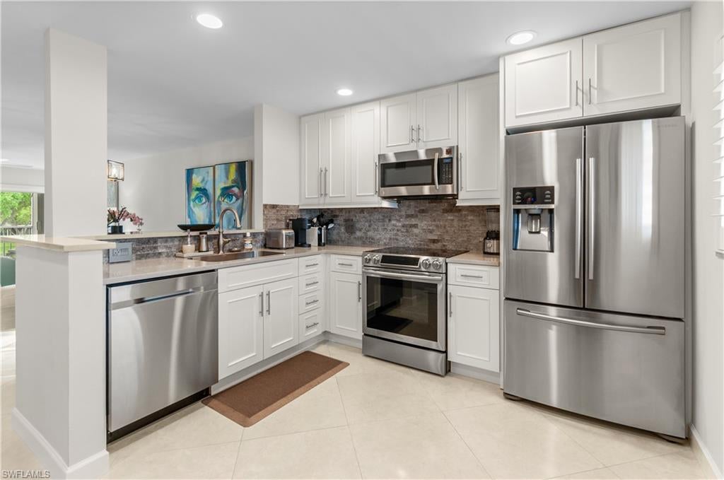 Welcome to Rivera at Moorings. This beautifully remodeled 2 bedroom 2 bathroom condo is updated and turnkey ready. The unit is finished with tile floors, hurricane impact windows and slider doors. The kitchen features solid wood cabinets with quartz counter tops, glass tile backsplash and stainless appliances. Enjoy the private screened in lanai with access from the living room and master bedroom, viewing the pool and lake. This 55+ community is centrally located in Naples and offers an optional membership to the private Moorings Beach. Only minutes from Venetian Village, Waterside shops and Downtown.