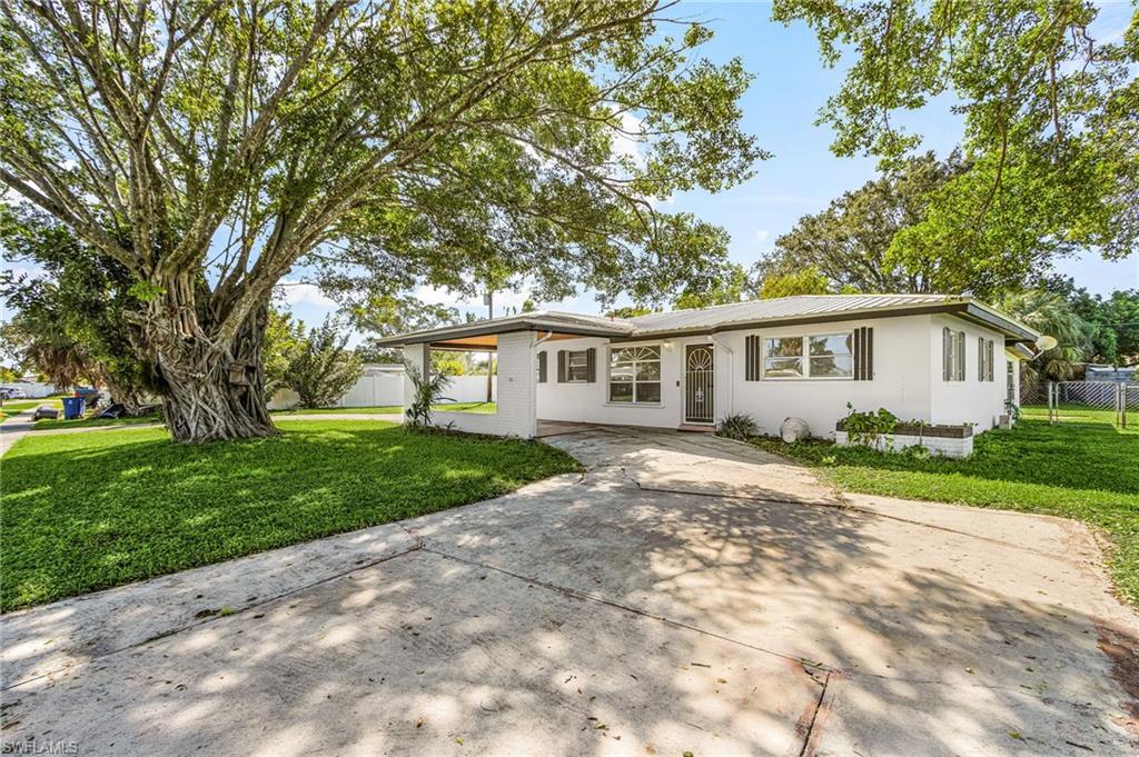 Tucked away on a peaceful cul-de-sac in the established Waterway Estates neighborhood, this charming 3-bedroom, 2-bath home offers 1,050 square feet of comfortable living space plus a generous 500-square-foot enclosed lanai. The lanai adds valuable extra room to relax, entertain, or enjoy Florida living year-round, sheltered from the elements.
Buyers will appreciate the major updates already in place: a new air conditioning system installed within the past year and a durable metal roof added in 2005, giving you comfort and peace of mind from day one.
Majestic banyan trees grace the front yard, providing natural shade and a welcoming curb appeal you won’t find in newer neighborhoods. Built in 1968, this home combines the character of classic Florida construction with the practical upgrades that matter most.
Conveniently located near Hancock Creek Elementary, Tropic Isles Elementary, and North Fort Myers High School, with easy access to shopping, dining, and everyday essentials. Homes on quiet cul-de-sacs like this don’t come along often. Schedule your private showing today!