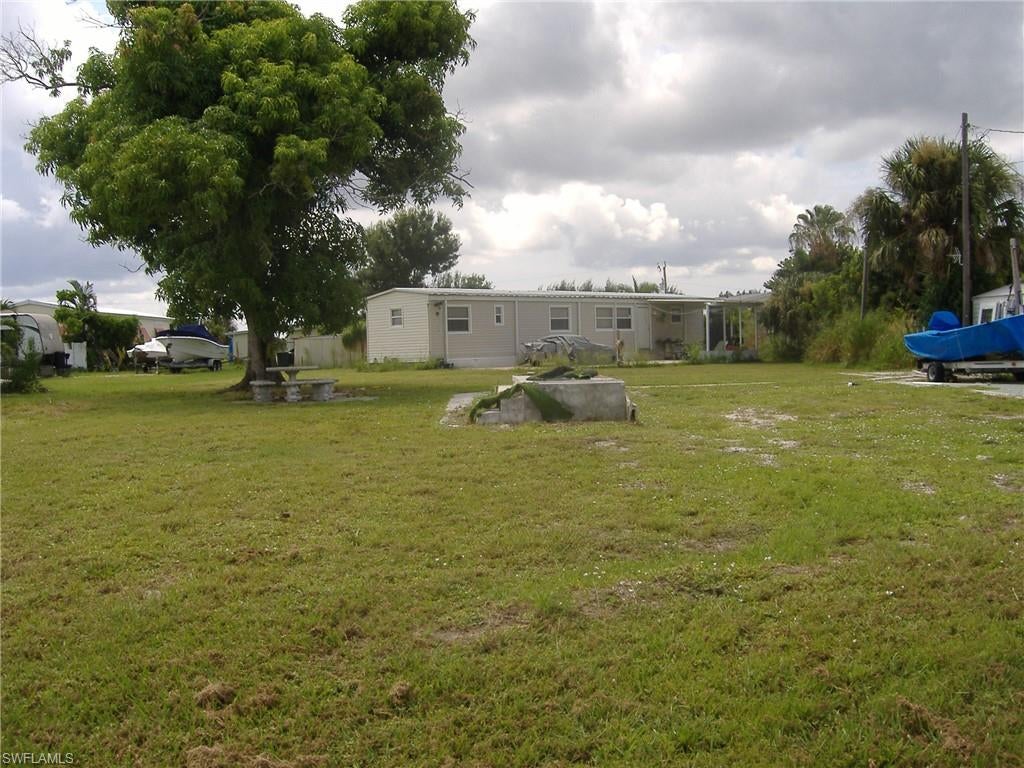 Located in Flamingo Bay on Pine Island, this property offers the relaxed Southwest Florida lifestyle. Enjoy boating, fishing, kayaking, and the laid-back island atmosphere. Pine Island is well known for its outdoor recreation and easy access to the bay and Gulf to world class fishing. An excellent opportunity to secure your piece of Pine Island to put your manufacture home or build a home. This lot is cleared and has a nice oak tree for shade. The HOA is voluntary or if you chose to become a member it is a one- time membership fee of $500.00, plus an annual fee of $325.00 per person. Members have access to a variety of recreational amenities, including heated pool, boat ramp, pickleball court, Shuffleboard, horseshoe pit and a Club house for community activities. The property is located near local restaurants, shopping, banks, and churches.