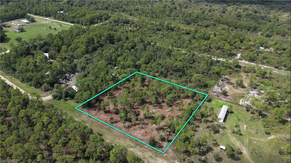 CLEARED lot with NO FLOOD ZONE to worry about! Easy electric hookup, right at the street. Not having to cut down and clear trees will likely save you $8,000 to $12,000 compared to buying a fully wooded lot with no improvements. This Hendry County parcel 1-31-43-28-A00-0100-0000. Mobile Homes OK here. Bring your RV, animals, country toys, and live in peace!  Electricity is available right at the street. Neighbors on both sides, this is a well developed block of Pioneer, with all of the neighboring properties also being 2.5 acres. Enjoy the perfect combination of nice trees and cleared space. When driving, after you turn right onto Panama Ave, it is the 3rd property on the left. It is easy to see where the fresh land clearing is, between the two developed lots on either side. For GPS directions, you can copy and paste these GPS Coordinates into Google Maps or Apple maps: 26.709908, -81.241133 (the same as you would paste an address. Its works the same way.) A street address will be assigned once you develop the property.