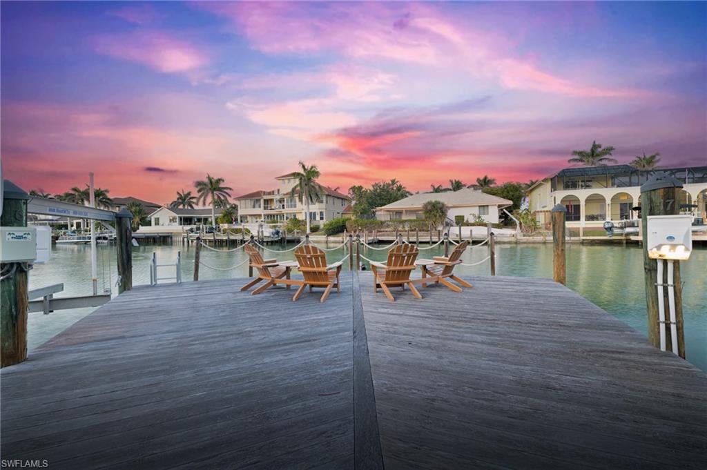 Live the ultimate waterfront lifestyle on Marco Island’s highly sought-after South End! This spacious top-floor condo offers the perfect combination of boating convenience and coastal living. Boaters will love the assigned finger dock and slip, with a boat slip immediately available and quick Gulf access through a no-wake channel. Plus, you’re just a short walk to the beach, making this the ideal spot for enjoying everything Marco Island has to offer.

Located on the 5th floor, this unit offers 1,630 sq. ft. of living space featuring hurricane sliders throughout, an enclosed lanai with shutters, and limited-access balconies with beautiful street and water views. The bedrooms include blackout curtains and sheers for added privacy. Recent updates include a new AC system installed in December 2023 and a brand-new hot water tank installed in 2025, ensuring modern comfort and efficiency.

The community offers a wide range of resort-style amenities, including an assigned covered parking space, a large swimming pool, exercise room and library, a social room with full appliances, a community ice maker and gas grill, kayak racks with a floating dock, a community workshop, assigned storage bins, and included cable and internet.

While the unit retains its original cabinets, dishwasher, and stove, it offers a fantastic opportunity for customization to create the perfect personal retreat. Just minutes from Caxambas Park and Marco Island’s pristine beaches, this condo truly is a boater’s paradise with all the comforts of resort living. Some images in this listing are virtually staged and may not represent the actual property. Don’t miss out on this rare opportunity—schedule your private showing today!