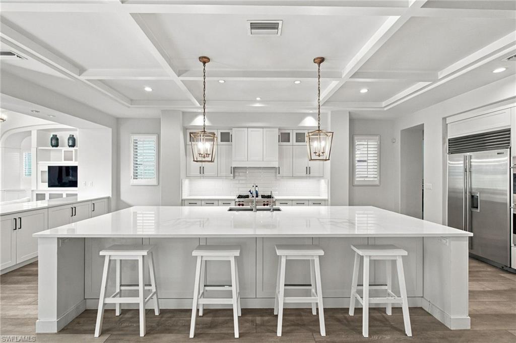 Located in Mediterra’s coveted Cortile neighborhood, this exceptional single-level residence offers nearly 3,900 SF of refined living space with 4 bedrooms, 4 full baths, and a 3-car garage. Transformed with a light, coastal aesthetic and wide-plank flooring throughout, the open-concept layout features a chef's kitchen equipped with Sub-Zero and Wolf appliances. Enjoy over 1,100 SF of outdoor living across a private courtyard with fountain and covered lanai with automated screens, backed by a sunny western rear exposure overlooking a private lake view. Enhanced with Andersen impact windows, plus low-maintenance living with landscaping and pool care covered by the Cortile association. The award winning Mediterra golf and beach club offers multiple levels of membership. New 38mil sports and wellness center underway!  Mediterra private beach club was recently renovated! 15million dollar golf course renovations underway! Buyer to assume CDD.