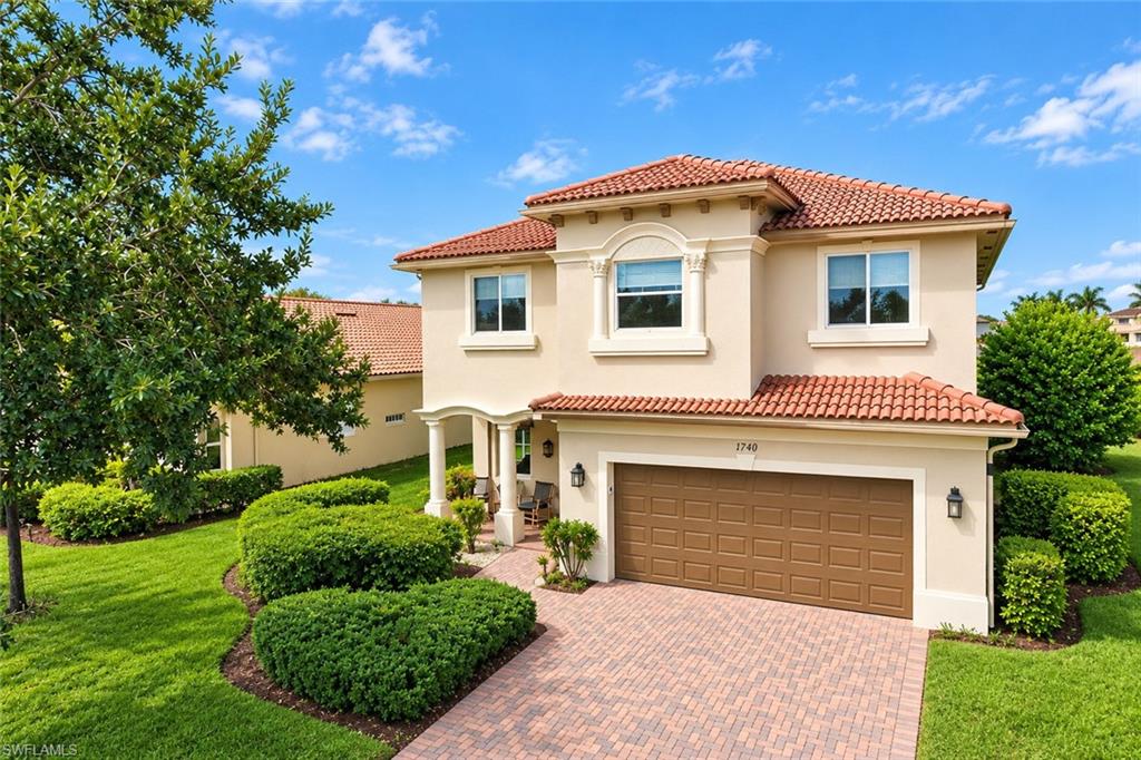 Located in the gated community of Valencia Golf and Country Club in Naples, Florida, this two-story, 5-bedroom, 4.5-bath home offers plenty of room for a larger household, with all five bedrooms and a bonus loft located upstairs. The home overlooks the 6th hole of the Valencia golf course, with a mid-fairway view and a lake beyond the fairway. The recently remodeled kitchen features quartz countertops with a waterfall-edge island, updated stainless steel appliances, a walk-in pantry, and an under-sink reverse osmosis system. The entire first floor has updated tile flooring throughout, with no carpet, along with a remodeled half bathroom and laundry room. The home features consistent flooring throughout, with no mix-and-match flooring from room to room. Additional features include a whole-house water purification system, hurricane shutters for all doors and windows, and a garage with a dedicated workspace, wall-mounted storage cabinets, lockers, and an organization system. Upstairs, the bonus loft provides flexible space for a TV room, play area, or home office. All five bedrooms feature matching waterproof wood-look laminate flooring. The oversized primary bedroom includes two walk-in closets and a large bathroom with separate his-and-her areas, each with its own toilet, a shared updated walk-in shower, and a jetted tub. The two updated guest bathrooms upstairs feature tub/shower combinations, with double sinks in one of them. Valencia Golf and Country Club is a dog-friendly community with low association fees and amenities including a resort-style pool, clubhouse, fitness center, tennis courts, and a dog park. The community also features an 18-hole public golf course with no mandatory golf membership. Conveniently located in the growing North Naples area near Publix, Founders Square, restaurants, shopping, and everyday conveniences, with Corkscrew Elementary, Corkscrew Middle, and Palmetto Ridge High School nearby. If you're looking for a five-bedroom home in Naples with golf course views, an updated kitchen, and flexible living space, this home is worth a look.