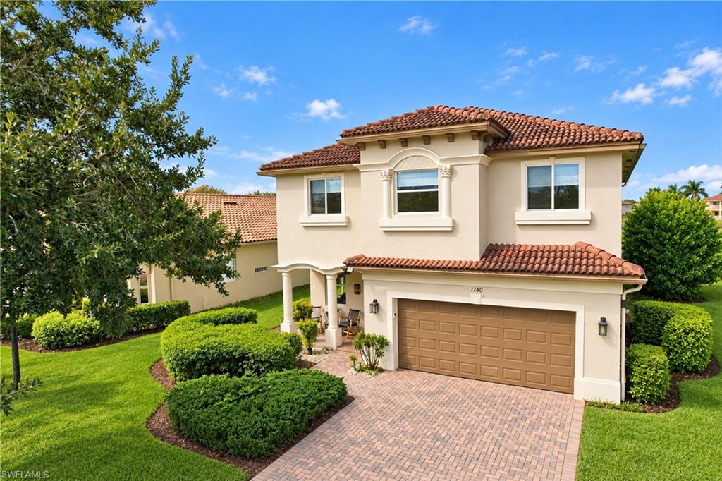 Located in the gated community of Valencia Golf and Country Club in Naples, Florida, this two-story, 5-bedroom, 4.5-bath home offers plenty of room for a larger household, with all five bedrooms and a bonus loft located upstairs. The home overlooks the 6th hole of the Valencia golf course, with a mid-fairway view and a lake beyond the fairway. The recently remodeled kitchen features quartz countertops with a waterfall-edge island, updated stainless steel appliances, a walk-in pantry, and an under-sink reverse osmosis system. The entire first floor has updated tile flooring throughout, with no carpet, along with a remodeled half bathroom and laundry room. Additional features include a whole-house water purification system, hurricane shutters for all doors and windows, and a garage with a dedicated workspace, wall-mounted storage cabinets, lockers, and an organization system. Upstairs, the bonus loft provides flexible space for a TV room, play area, or home office. All five bedrooms feature matching waterproof wood-look laminate flooring. The oversized primary bedroom includes two walk-in closets and a large bathroom with separate his-and-her areas, each with its own toilet, a shared updated walk-in shower, and a soaking tub. The two updated guest bathrooms upstairs feature updated finishes and tub/shower combinations, with double sinks in one of them. Valencia Golf and Country Club offers low association fees, a community pool, clubhouse, fitness center, and an 18-hole public golf course with no mandatory golf membership. Conveniently located in the growing North Naples area near Publix, Founders Square, restaurants, shopping, and everyday conveniences, with Corkscrew Elementary, Corkscrew Middle, and Palmetto Ridge High School nearby. If you're looking for a five-bedroom home in Naples with golf course views, an updated kitchen, and flexible living space, this home is worth a look.