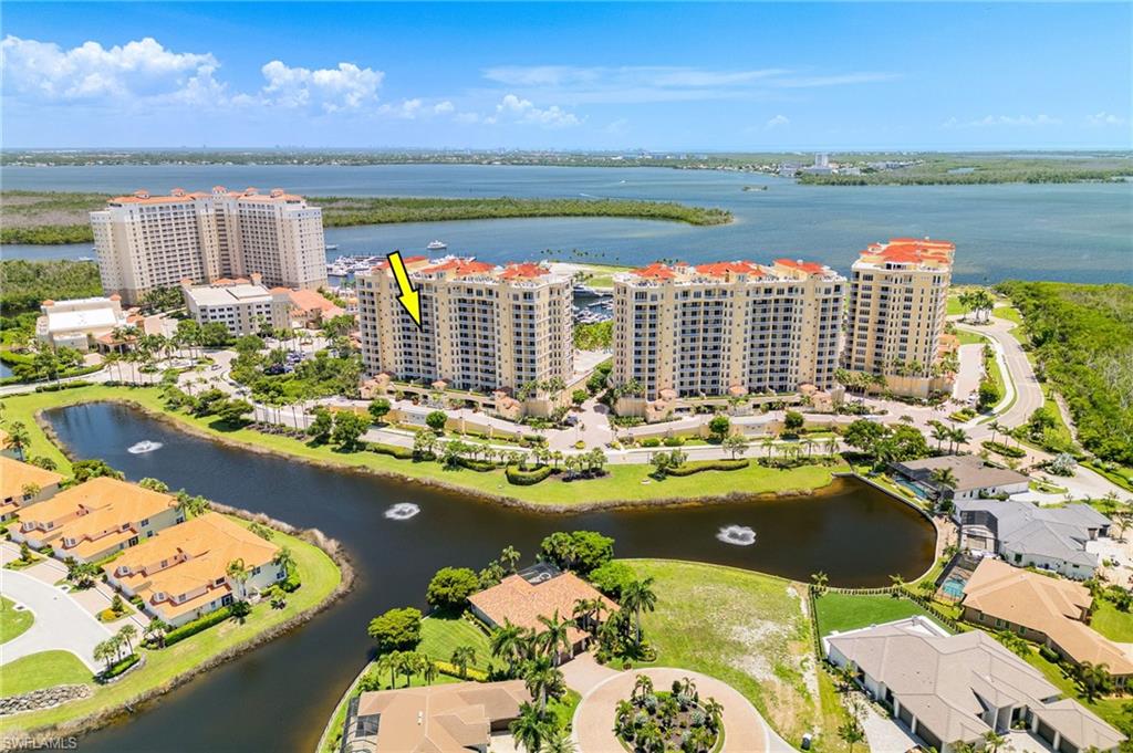 Experience luxury living at its finest in one of Cape Coral's most sought-after waterfront communities. Being offered turnkey, this condo offers a sprawling 3 bedrooms plus den with 3 full baths and a half bath for guests, plus a rare two car garage. The secure, private elevator brings you to your spacious condo, where each bedroom and the living area all have balconies, including the marina and river views from both the master bedroom and the living area. Made for entertaining, the kitchen boasts a built-in Sub Zero refrigerator, Wolf appliances, built in wall ovens, with upgraded details such as under cabinet lighting and a farmhouse sink. This condo offers tile throughout, has a Travertine accent wall in the living area, a dry bar with mini-fridge, with ample space perfect for hosting guests. Right within the community, there are multiple shops, restaurants, the marina, and a hotel, all within a short drive to our local beaches and other entertainment districts. This home truly offers it all, from luxury to security, entertainment and amenities, all within the highly revered Tarpon Point neighborhood.